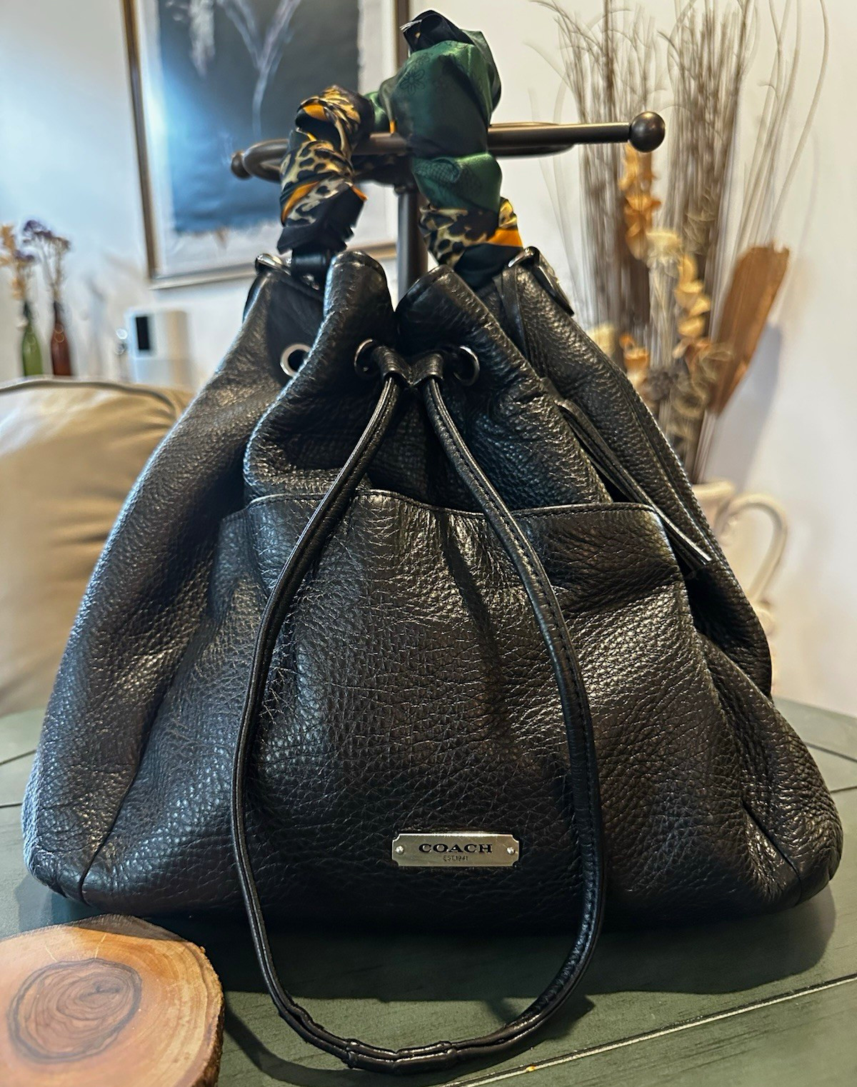 Coach Avery bucket bag. Drawstring closure and silver-tone hardware.