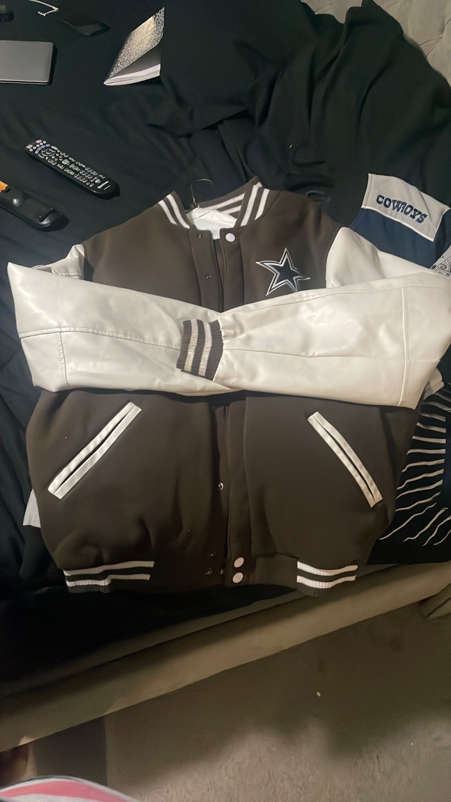 brown and tan reversable cowboys jacket