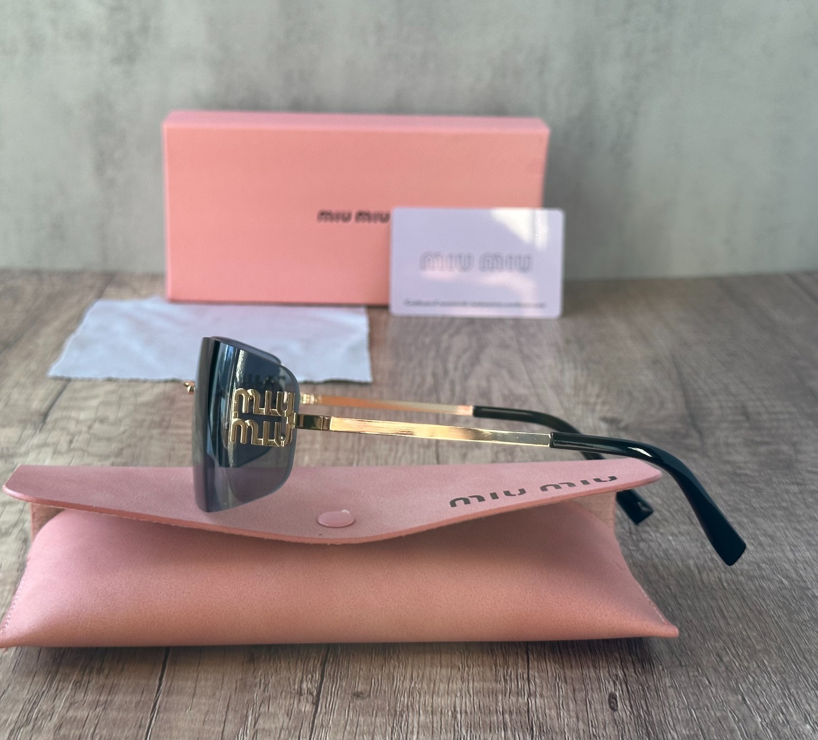 MIU MIU SUNGLASSES BLACK GRAY 100% AUTHENTIC WITH ORIGINAL PACKAGE SHIELD