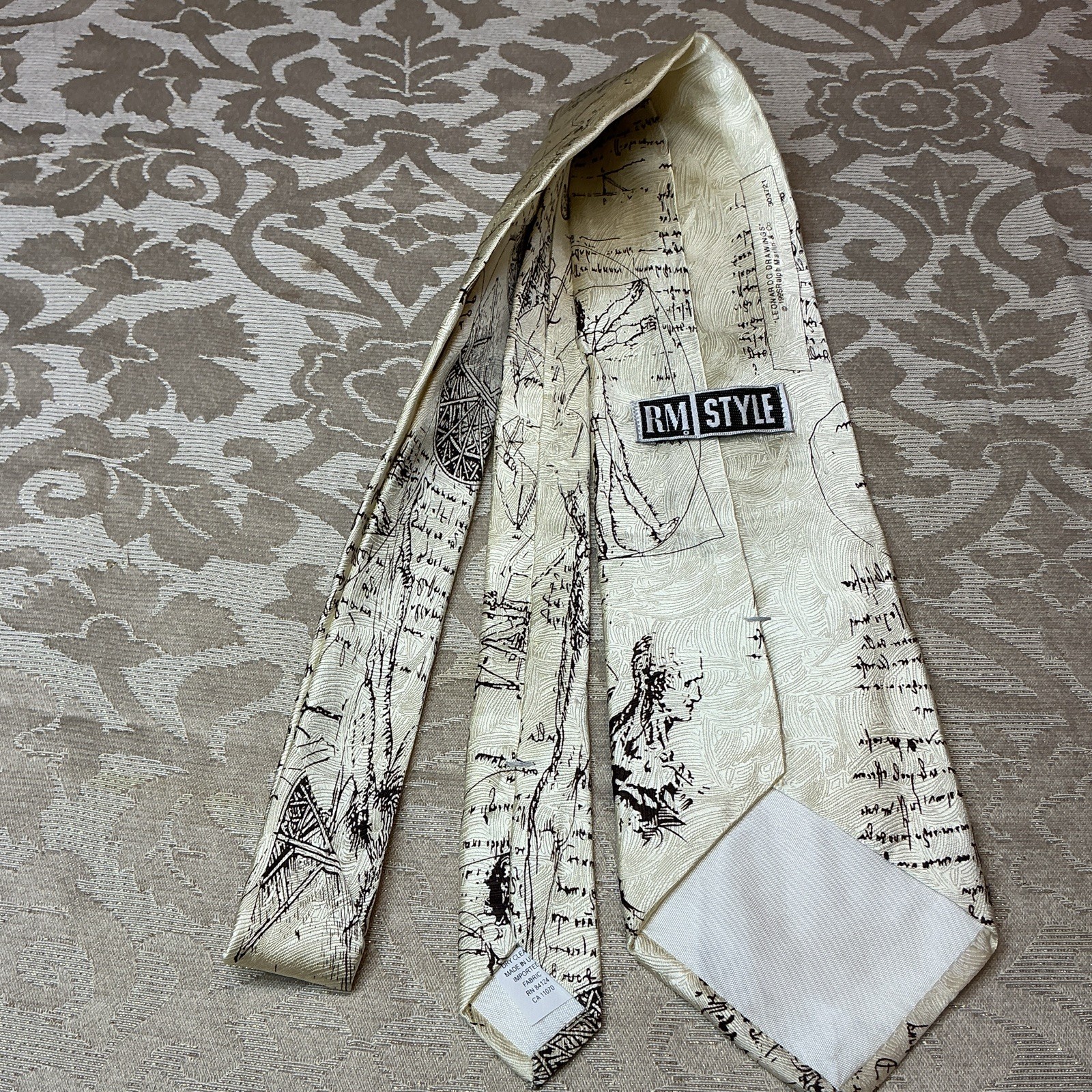 RM Style Men’s Woven Silk Graphic Print Tie Ivory/Black Da Vinci Logo 1-Piece