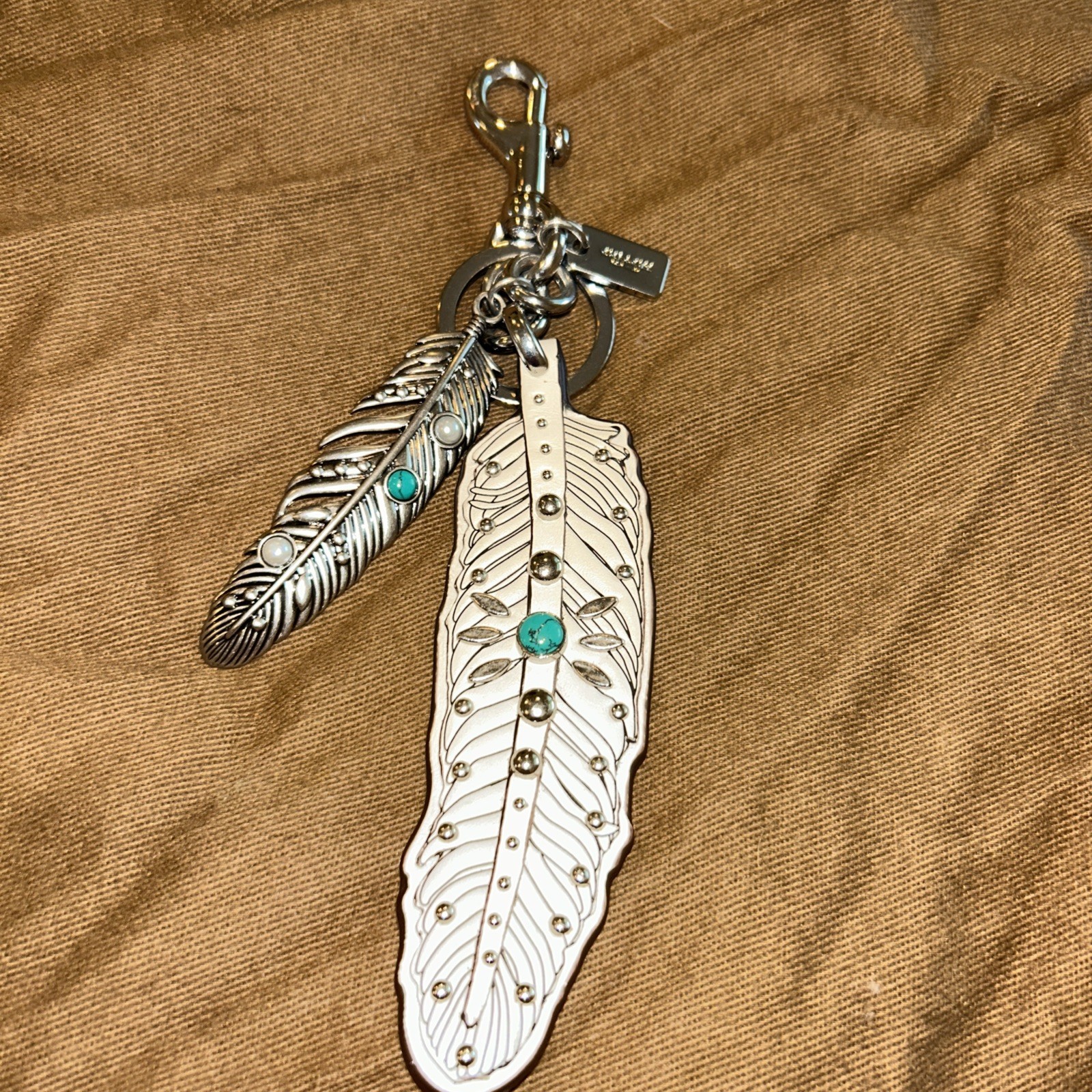 Coach Rare Turquoise and Silver Feather Hang Tag. Excellent Condition