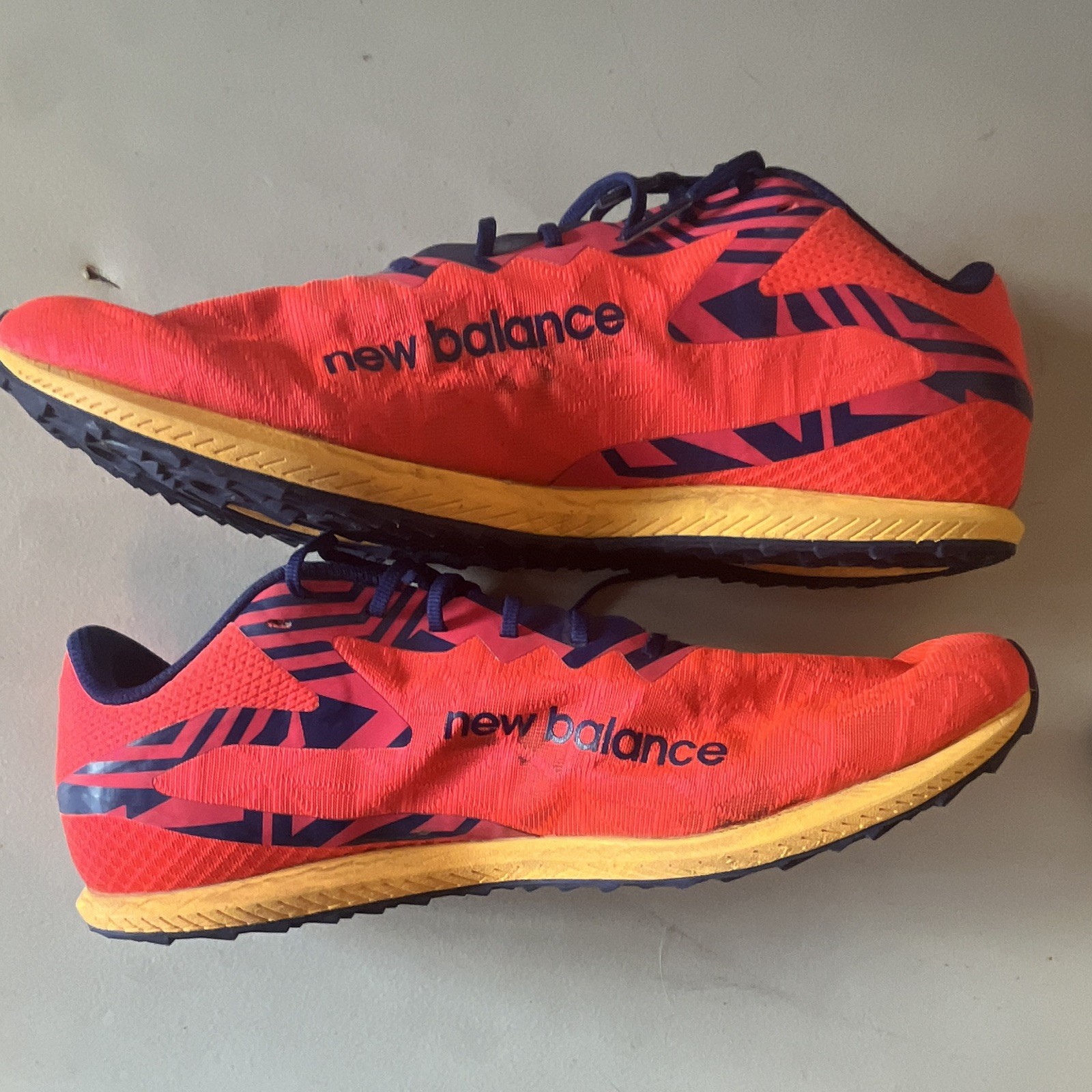 New Balance Men’s Red/Blue Low Top Lace-Up Athletic Sneaker Metal Cleats