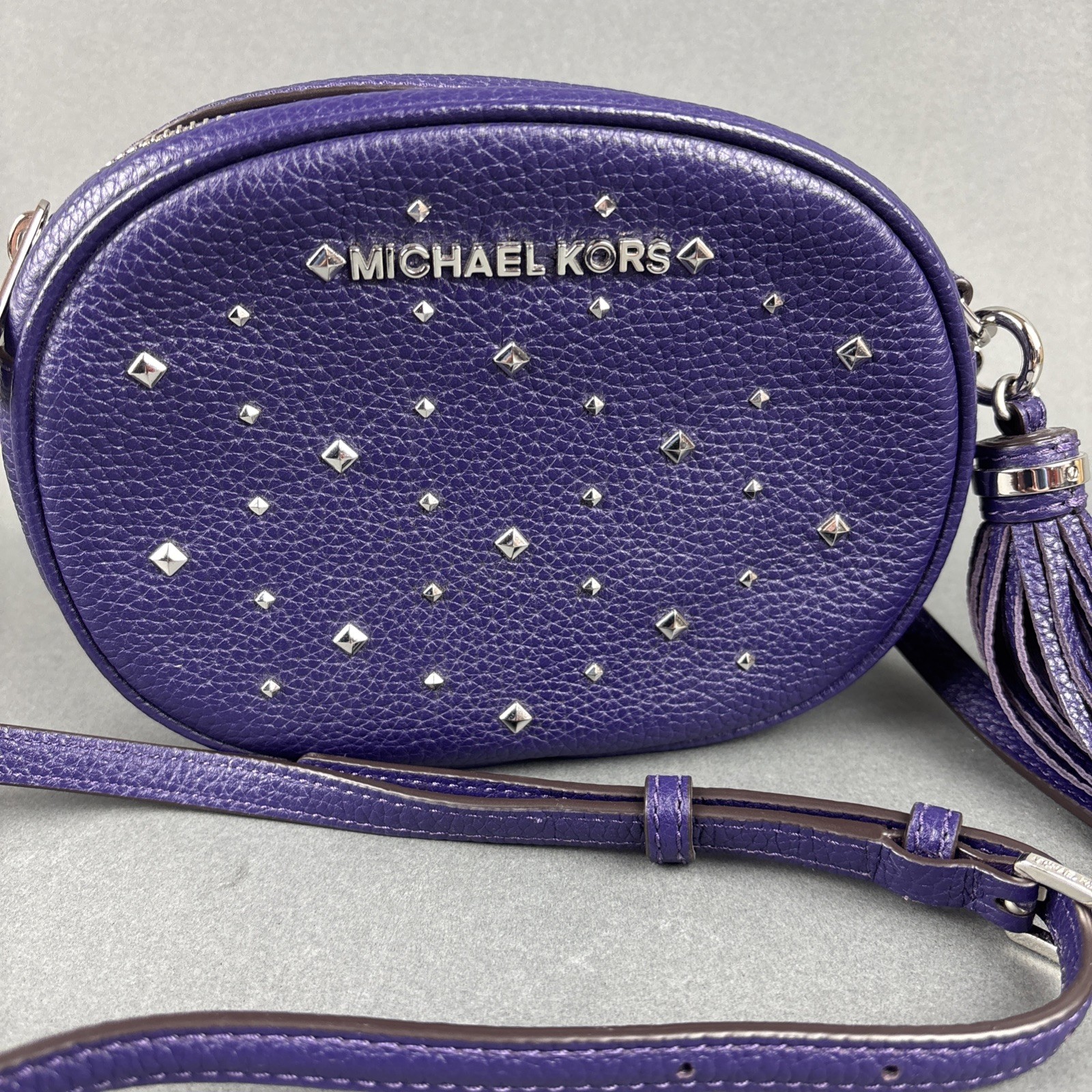 Michael Kors Purple Pebbled Leather Small Oval 7.75″x5.5″ Crossbody Bag w/Tassel