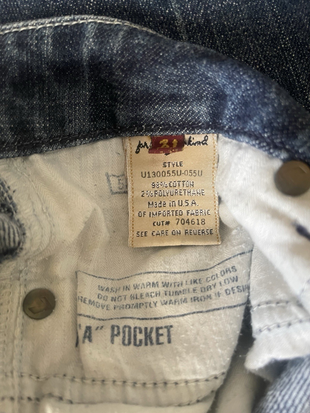 7 For All Mankind low-rise bootcut jeans featuring a medium wash Size 31