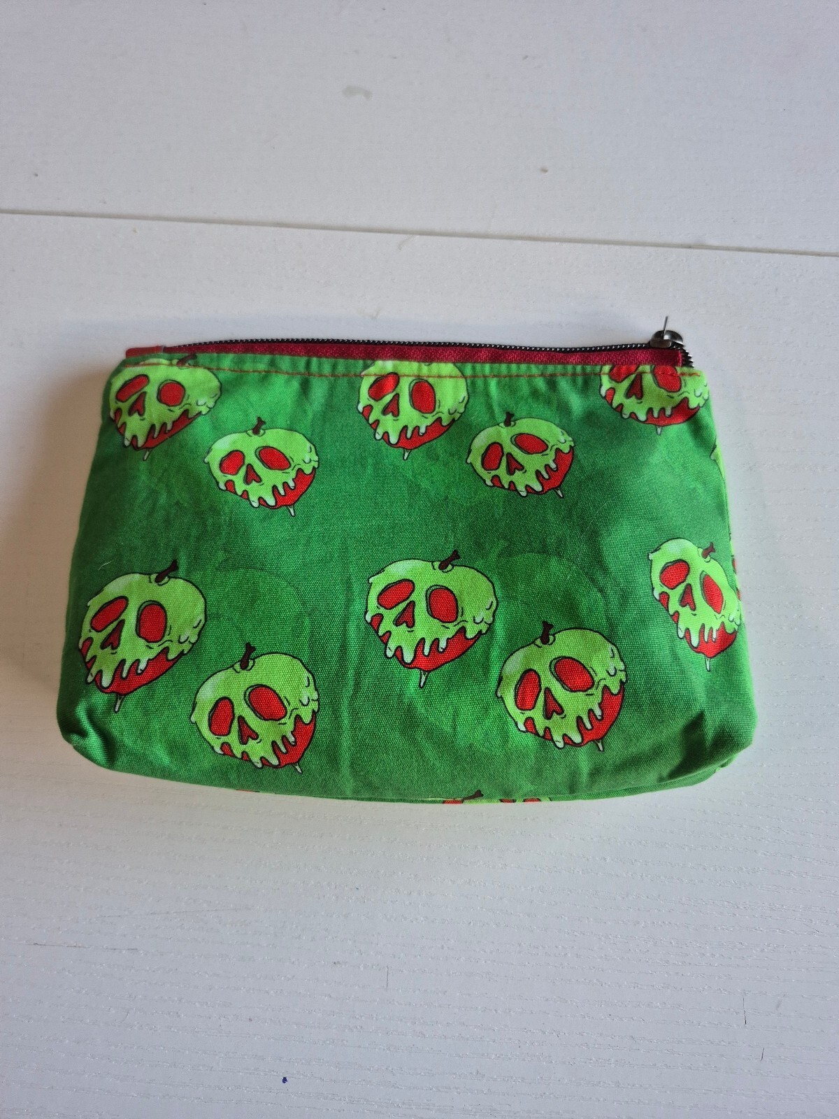 poison red apple on green cotton fabric Cosmetic Pouch, w/ red canvas lining