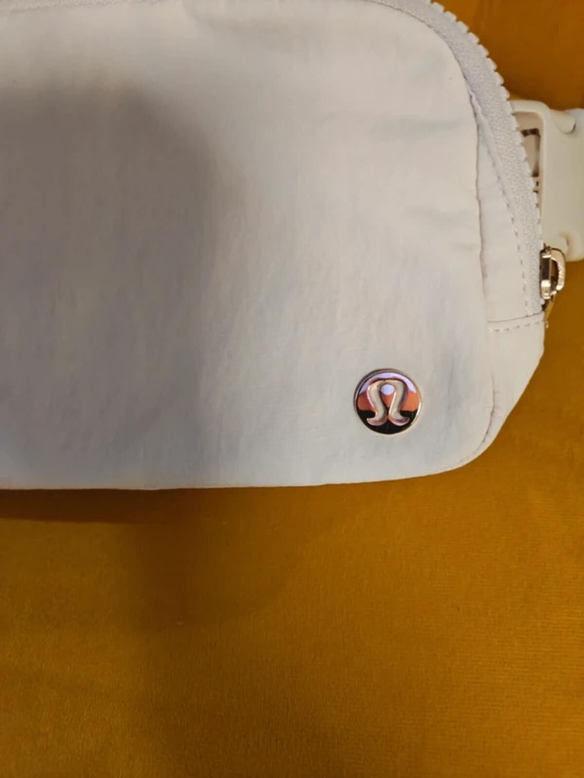 Lululemon belt bag with bold Metallic gold Logo