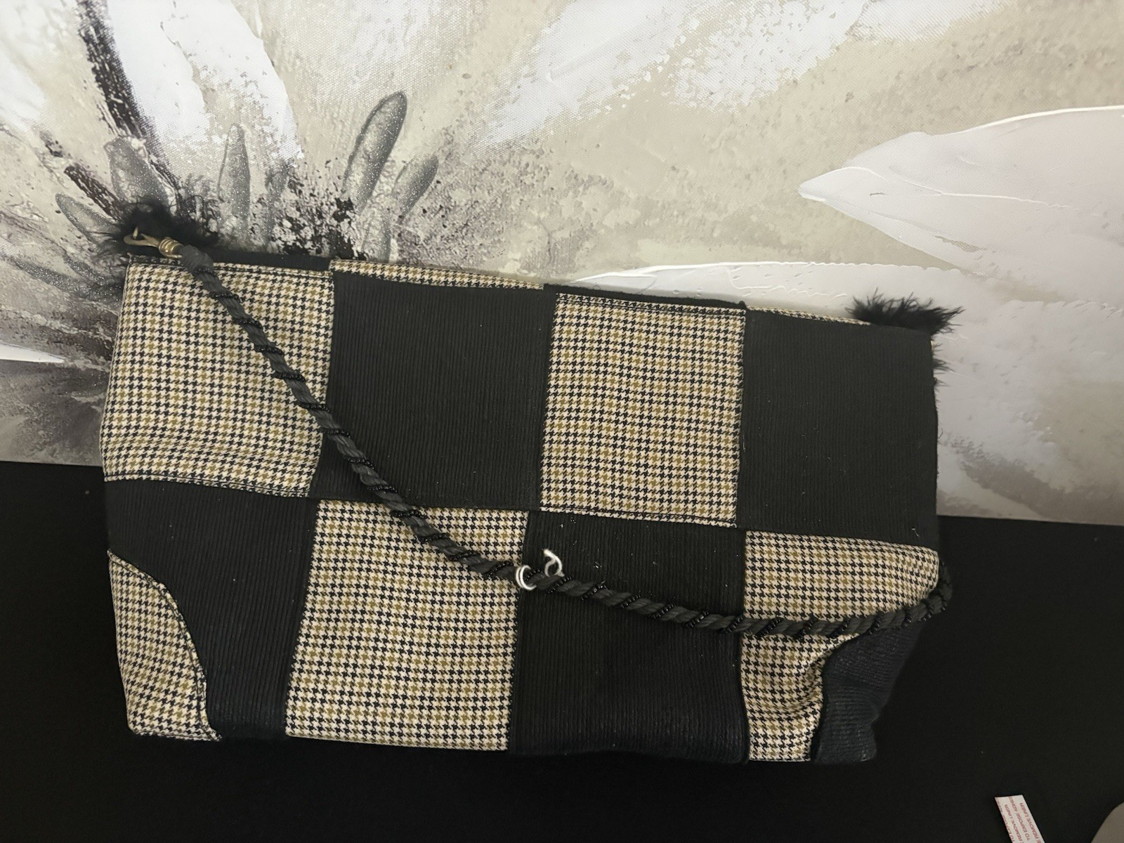 Elevate your style with this chic black and tan checkered women’s Handbag