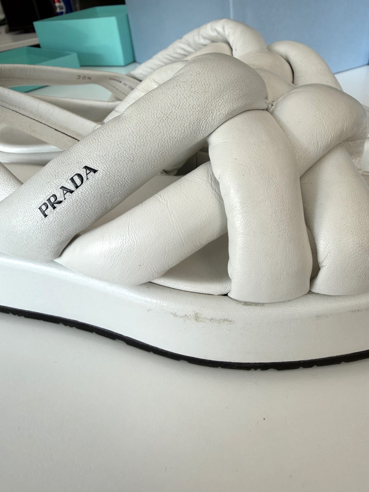 Women’s PRADA Padded Nappa Leather Flatform Sandals in white. Size: 38.5 EU