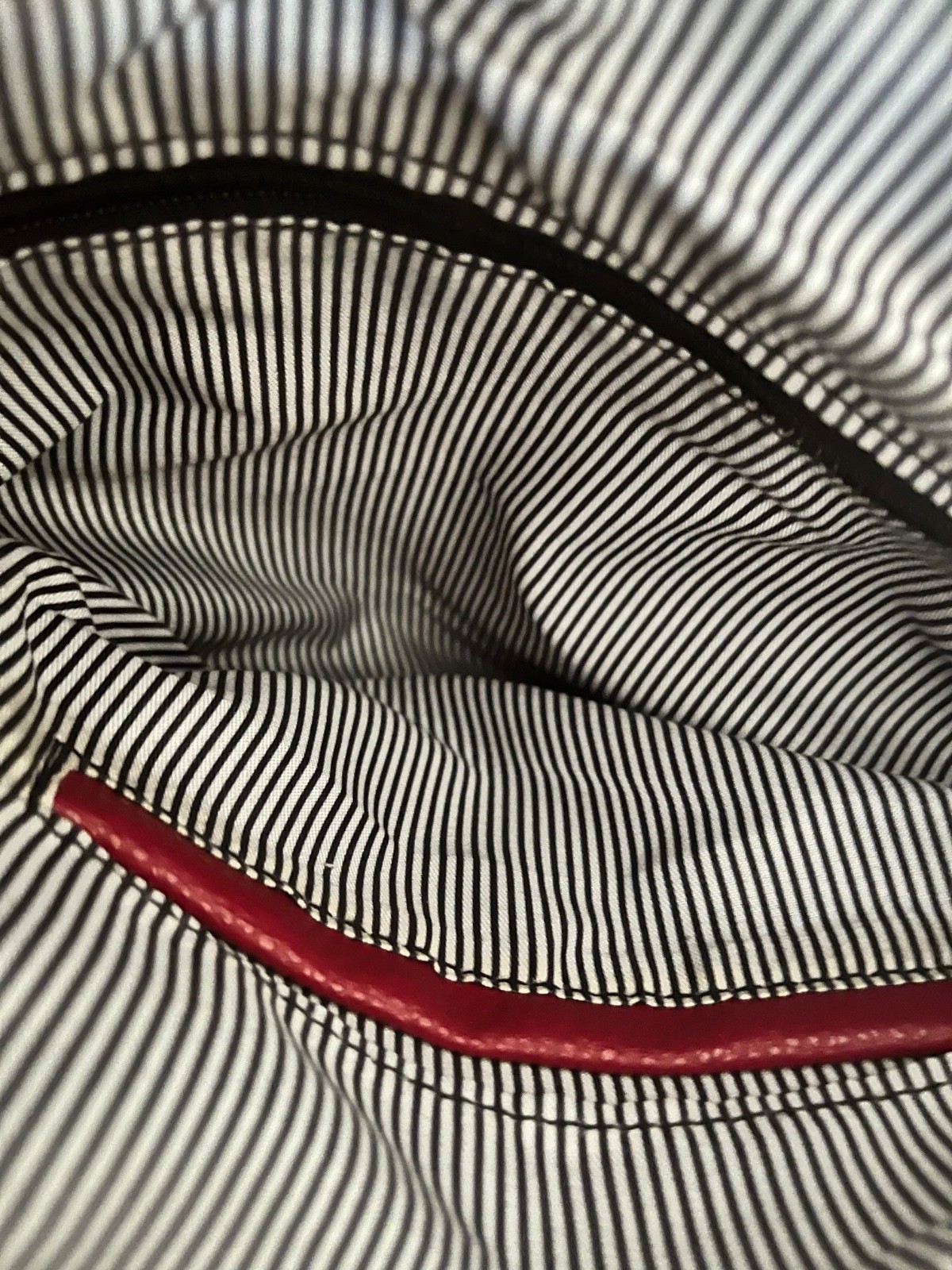 Red pebbled shoulder bag nwot stripe fabric inside pockets in and out 8 1/2×12