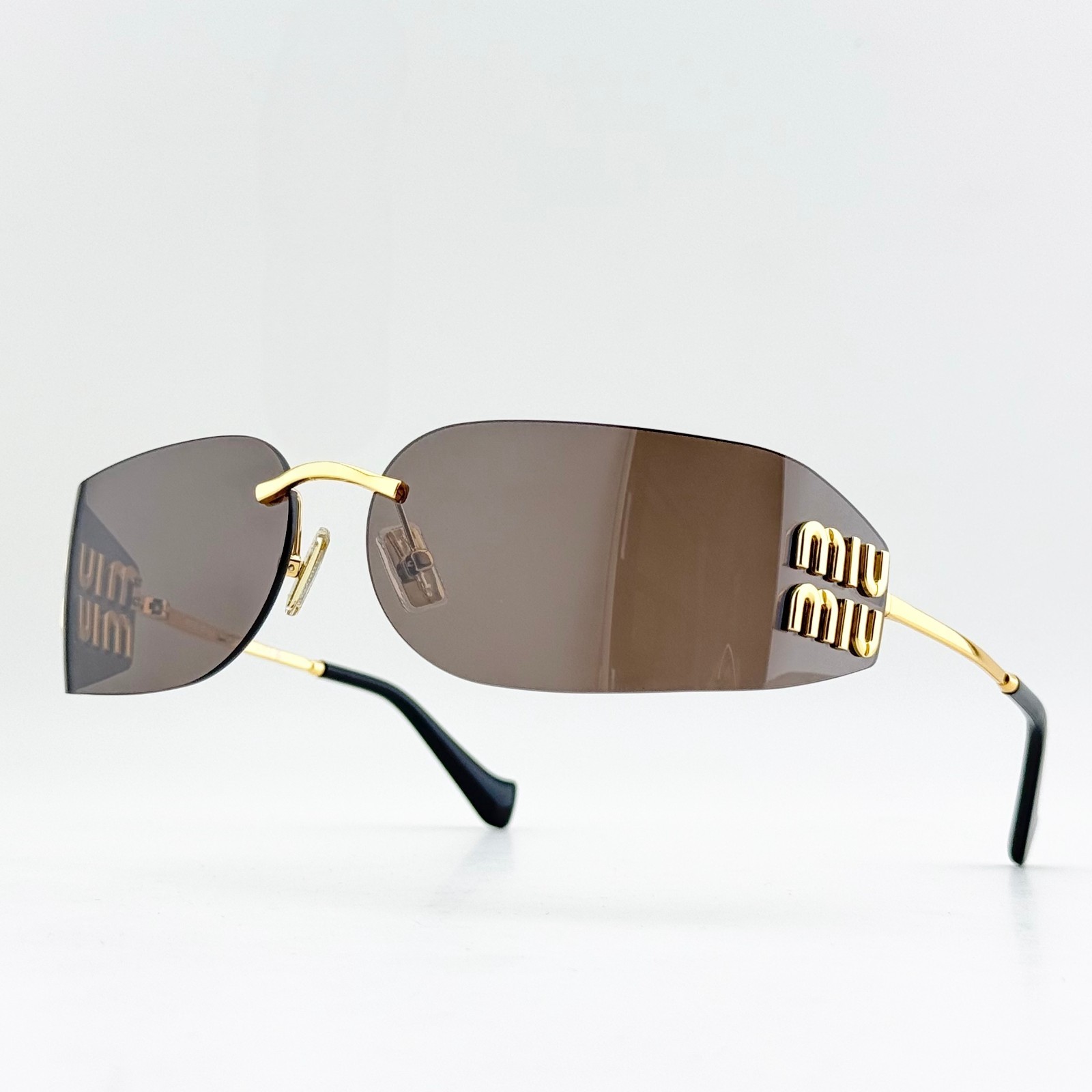 Miu Miu SMUA51S Rimless Gold Frame Brown Lens Oval Sunglasses Women 75mm