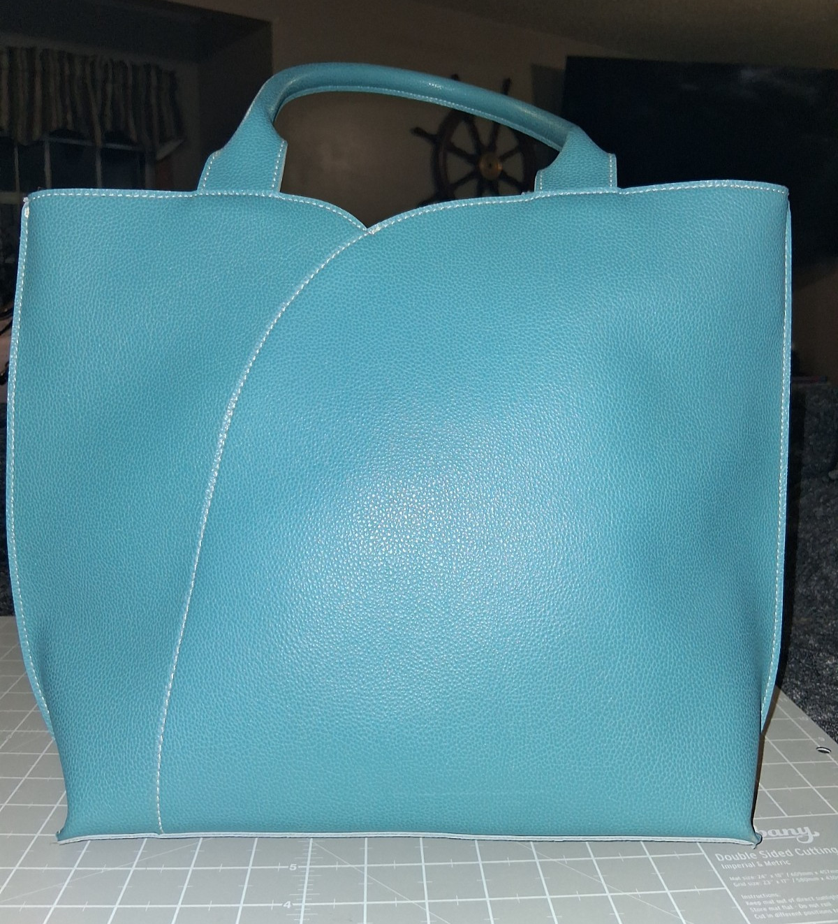 Mellow World tote grained vegan leather tulip curved front panel vibrant teal