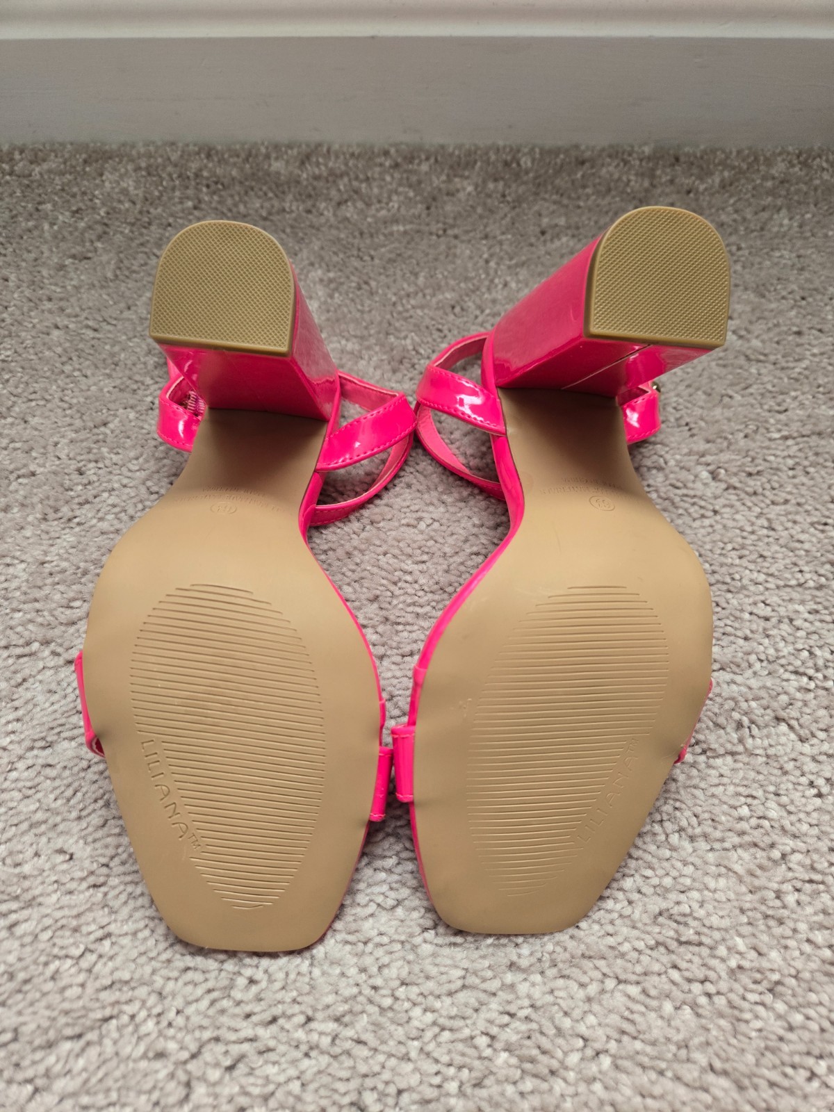 Brand new. Never worn. Pink . Leathery material . Size 6.5 . High heel