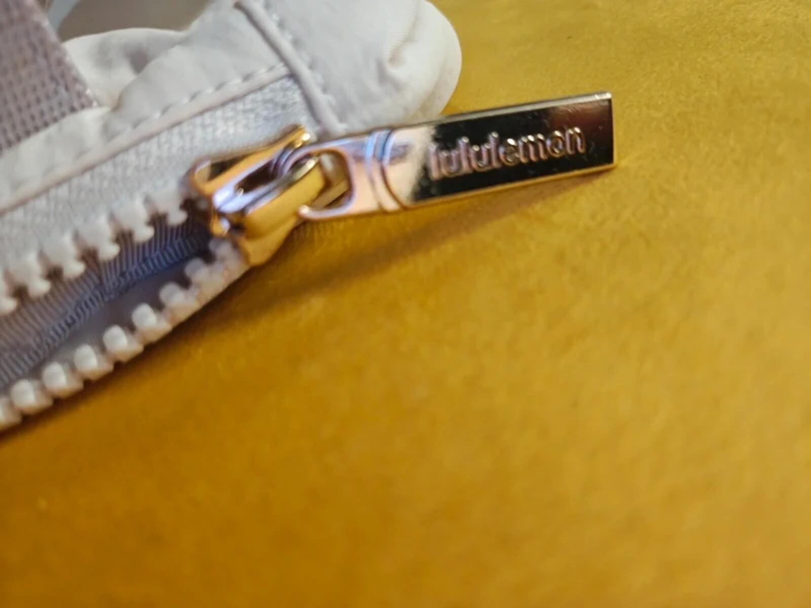 Lululemon belt bag with bold Metallic gold Logo