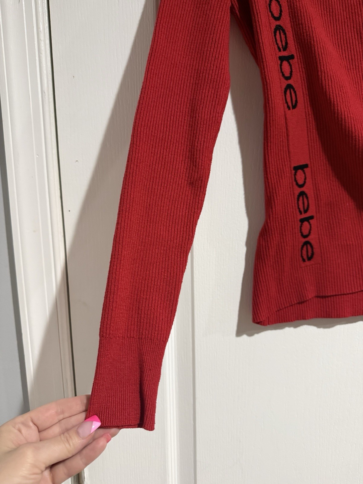 BEBE Red Asymmetric Side LOGO Faux Wrap Ribbed Knit V Neck Sweater Size Small