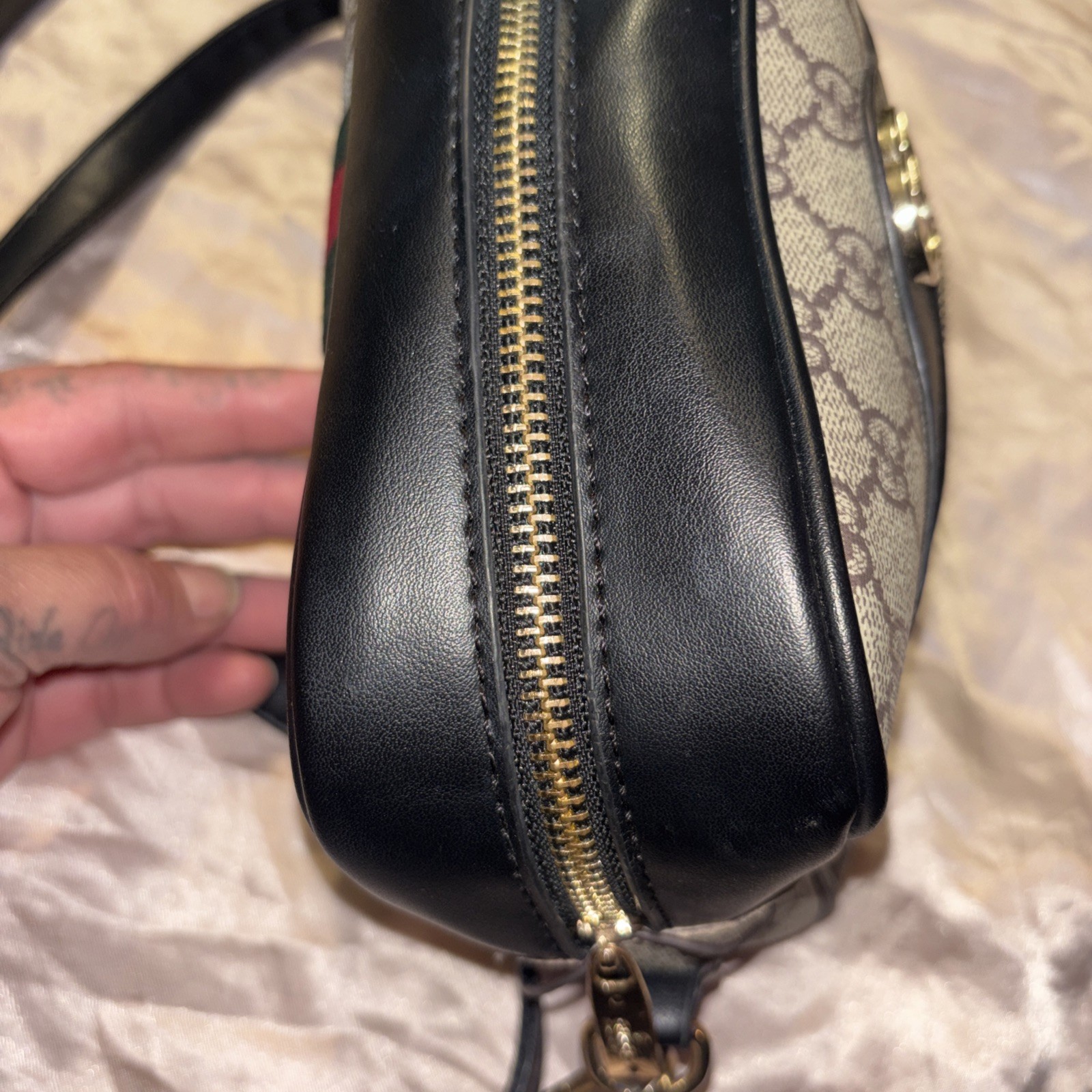 This is a Gucci GG Supreme Ophidia camera-style shoulder bag.