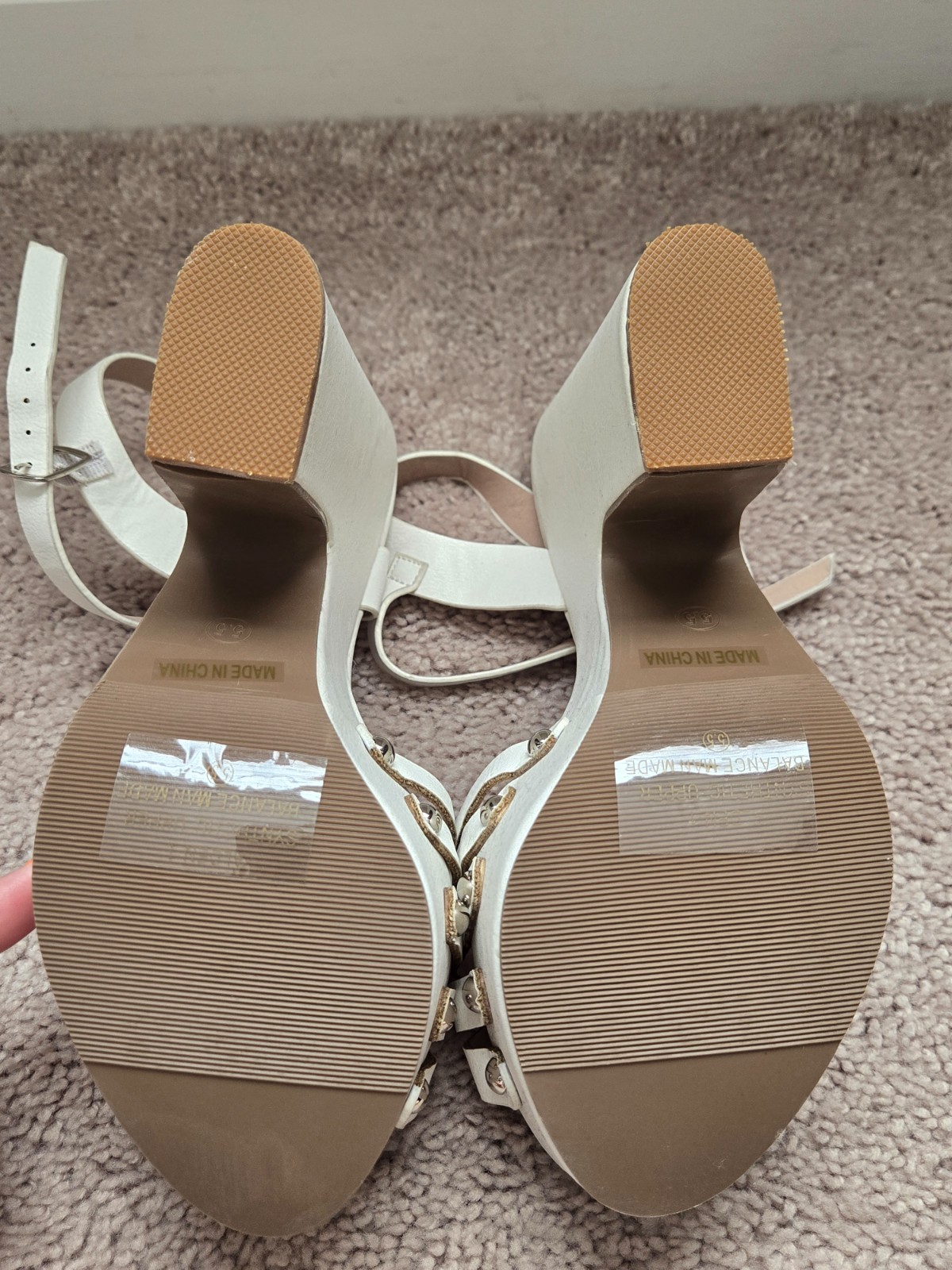Brand new. Never worn. White faux soft leather high heels with wide heel