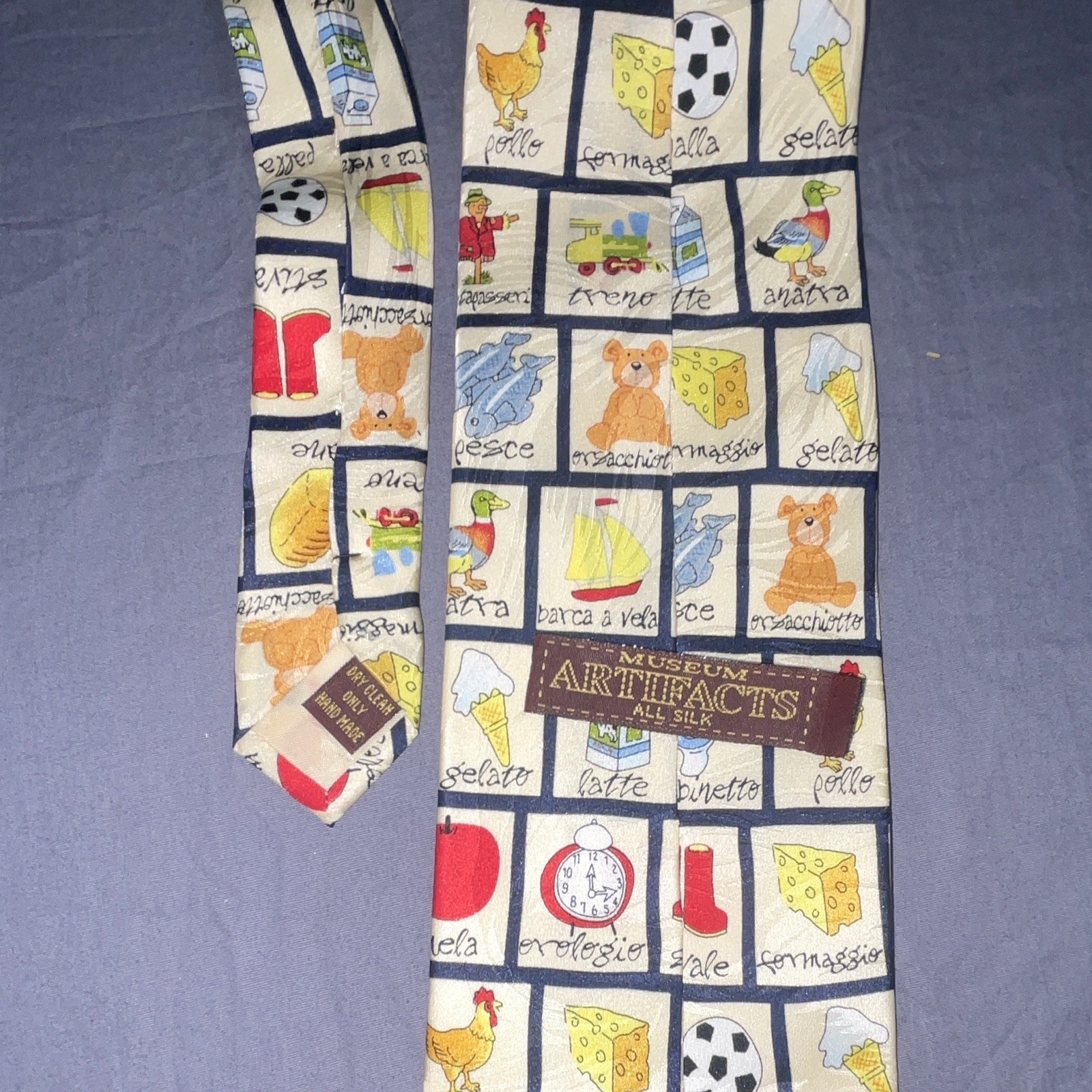 Museum Artifacts Beige/Multicolor Novelty Silk Woven Pointed Men’s Tie Logo