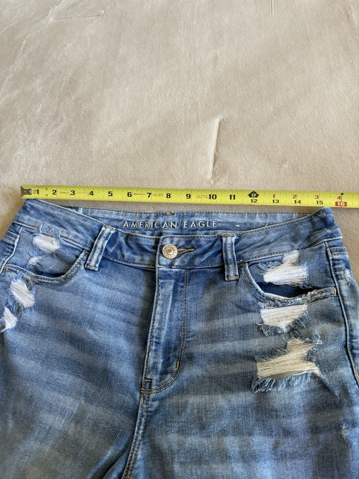 American Eagle Women’s Blue Light Wash High Rise Distressed Jegging