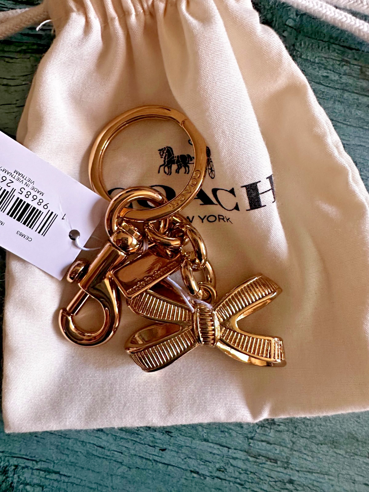 NWT Coach CEM83 Bow Bag Charm Gold/Gold CEM83 with Dust bag🎀