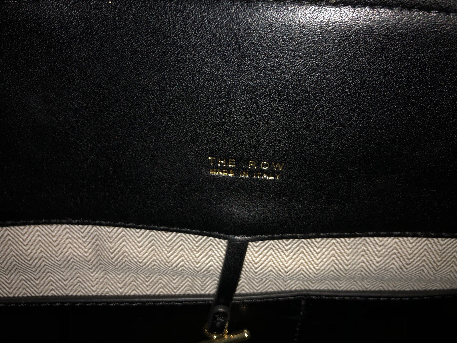 The Row Margaux 15 black with gold hardware