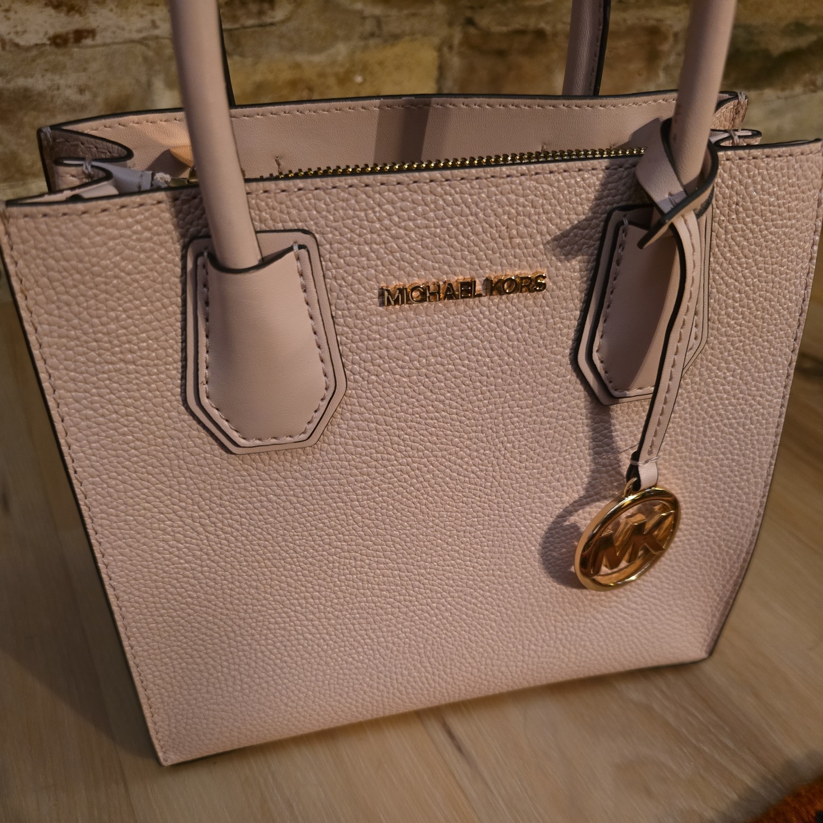 Michael Kors Pink Powder Blush Leather Bag is 10 x 9″ and 6″ deep