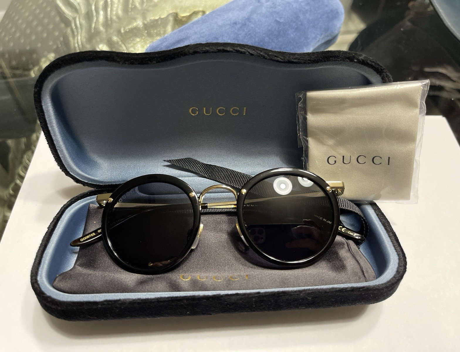 Gucci GG0674S 001 Men’s Round Sunglasses Black Frame Gray Tinted Lenses