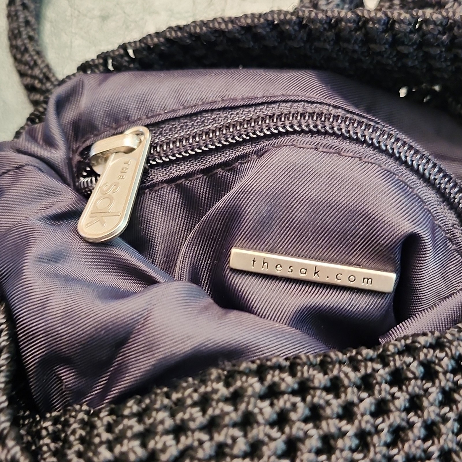 The Sak Women’s Black Solid Shoulder Bag Zip Top Lined Pockets Silver Charm