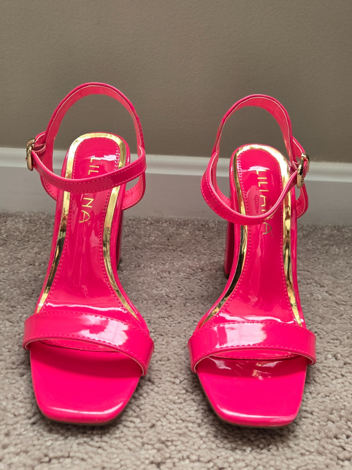 Brand new. Never worn. Pink . Leathery material . Size 6.5 . High heel
