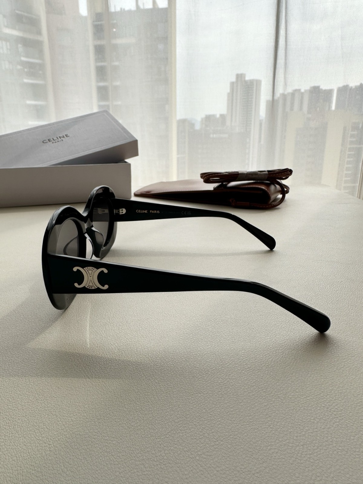 CELINE Iconic Triomphe Oval Sunglasses Black Frame Gold Logo Detail