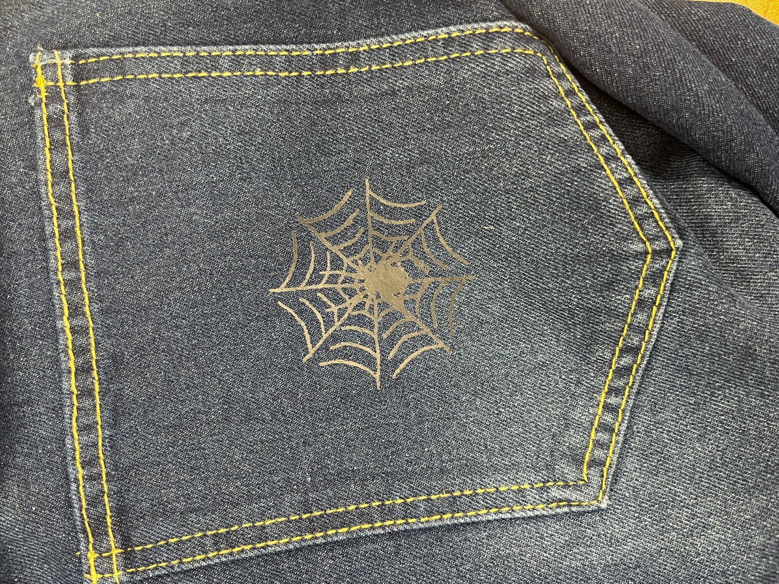 VYLLAN spyder jeans check description