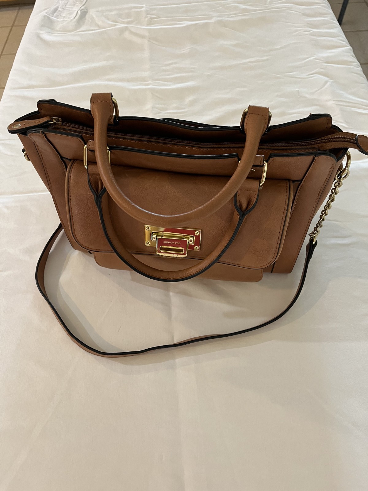 New London Fog leather purse with side pocket .