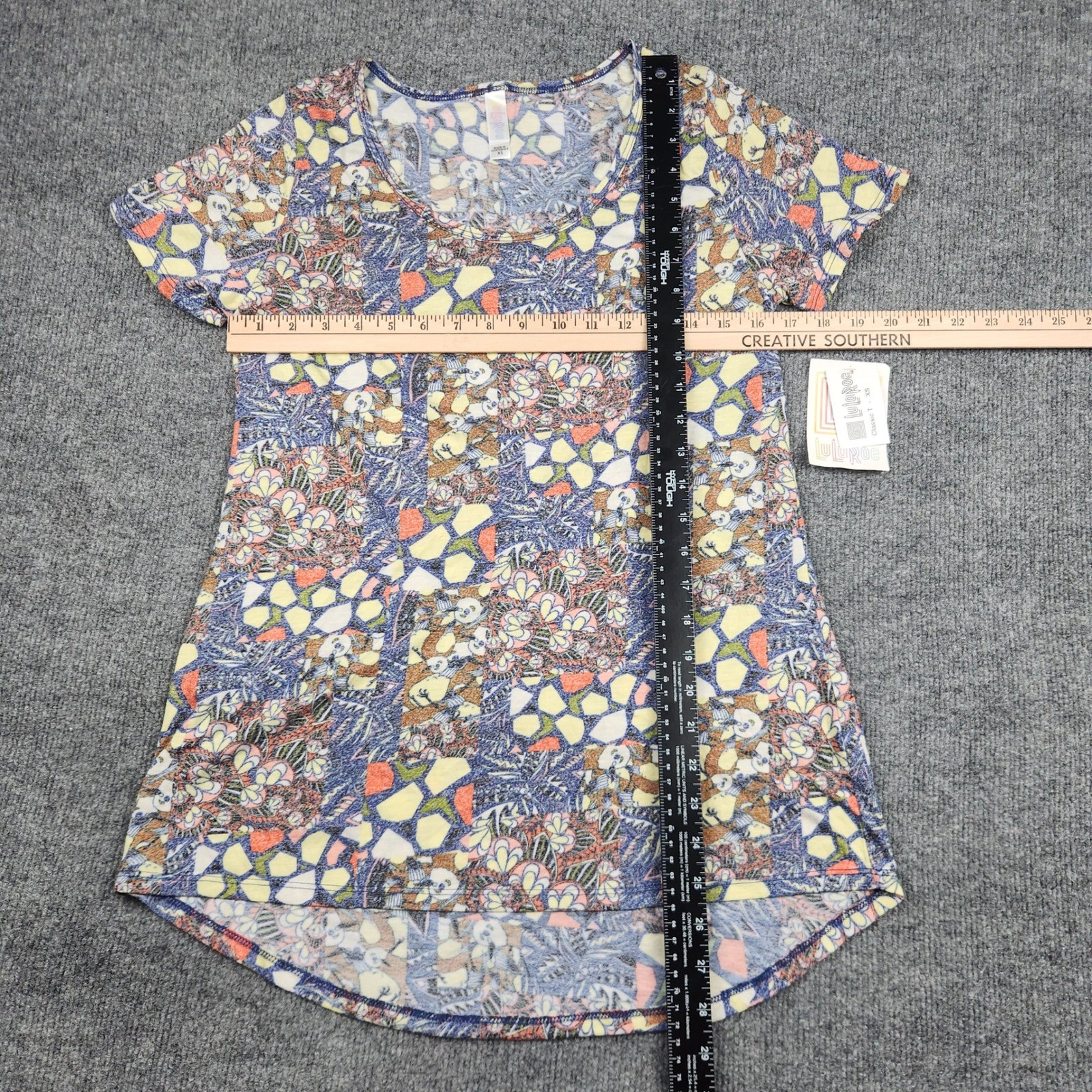 LuLaRoe Classic T Womens XS Blue Yellow Floral Geometric Patchwork High Low Top