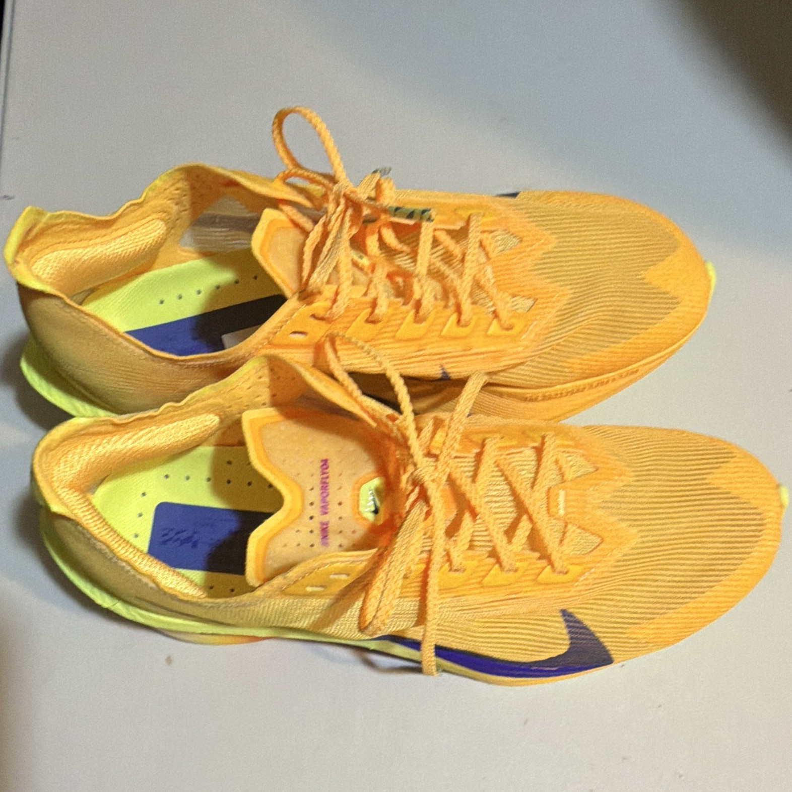 . Nike women’s Orange/Purple/Yellow Low Top Lace-Up Athletic Sneakers