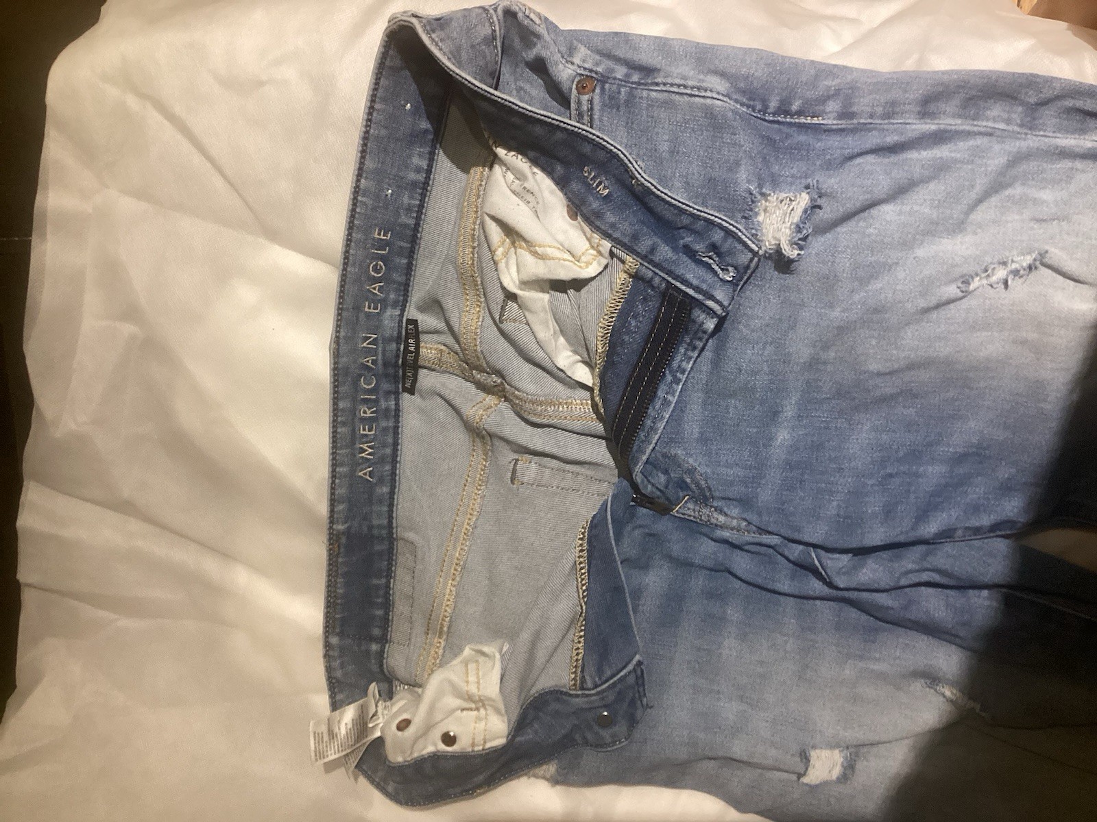 American Eagle Men’s Next Level Air Flex Slim US 33×32–Light Blue -Distressed