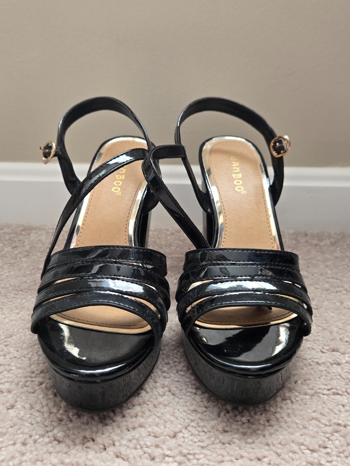 Brand new. Size 6.5. Never worn. Black faux leather. Strap