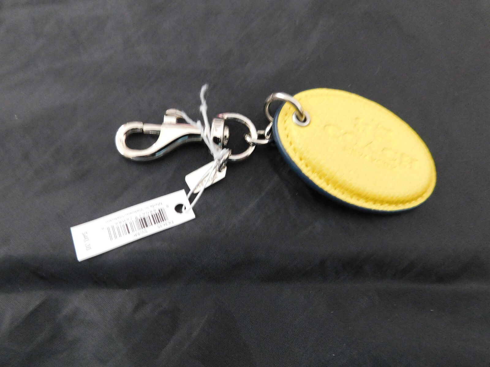 NWT “1” Coach Key Ring F63635 Badlands Oval Chalk. Keyring/Keychain/Bag Charm.