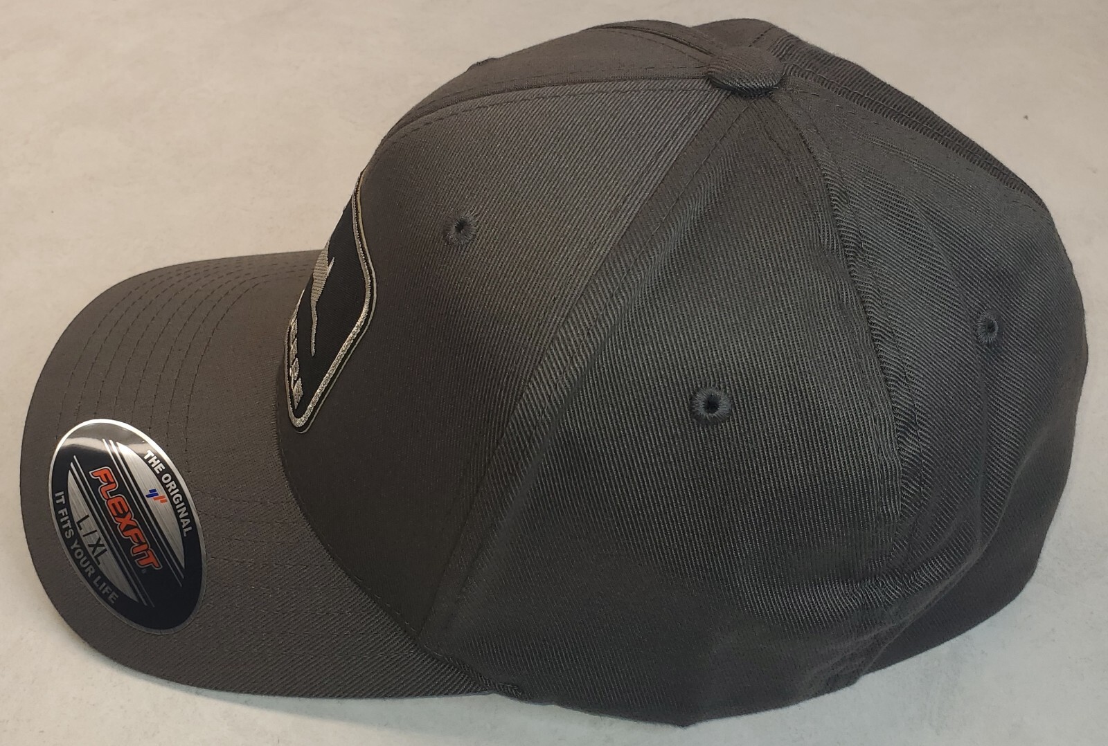 John Deere Black Patch on Flexfit Style 6277 / Charcoal – L/XL 7 1/8″ – 7 5/8″