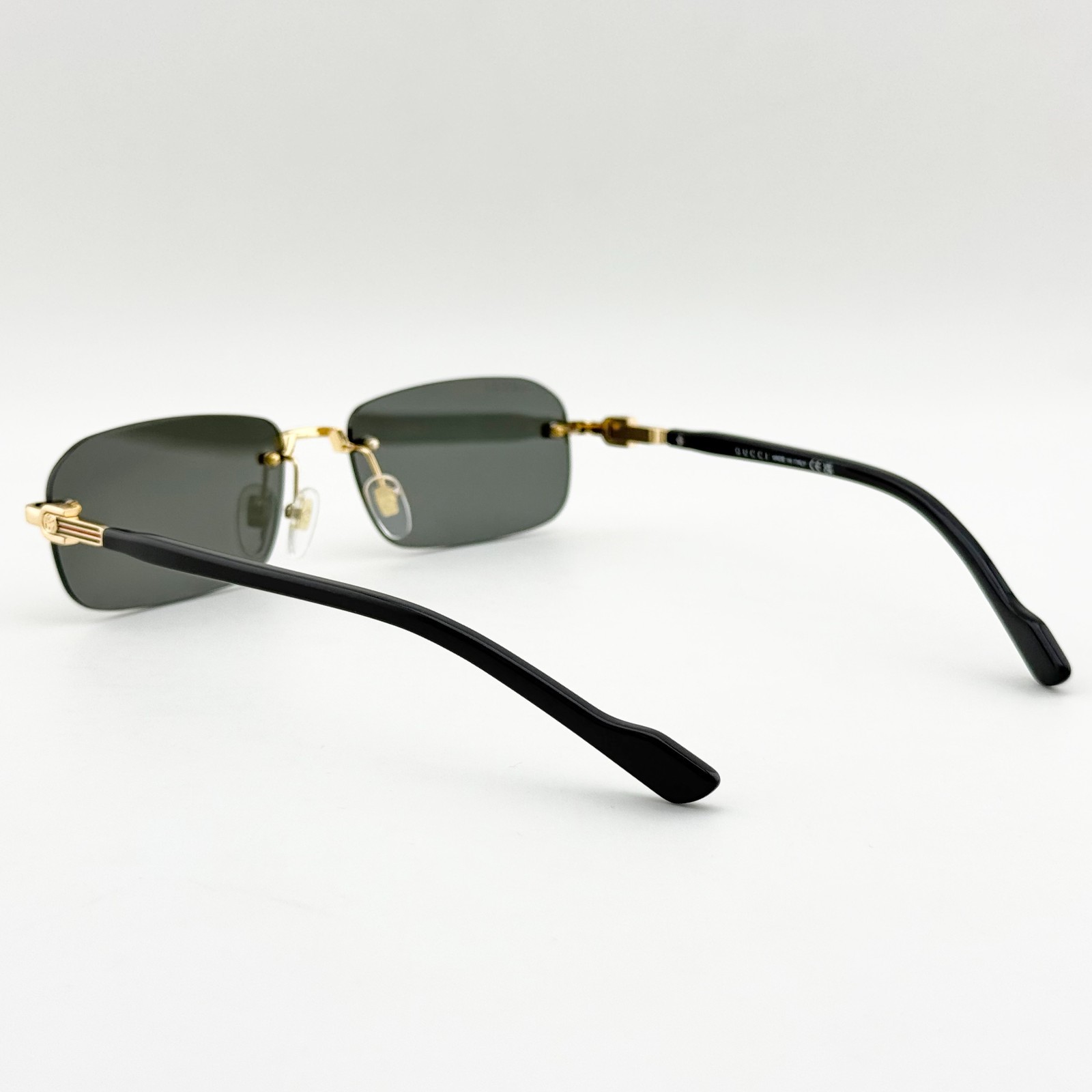 Gucci GG1221S 001 Rimless Gold Black Gray Lens Sunglasses 56mm Men’s