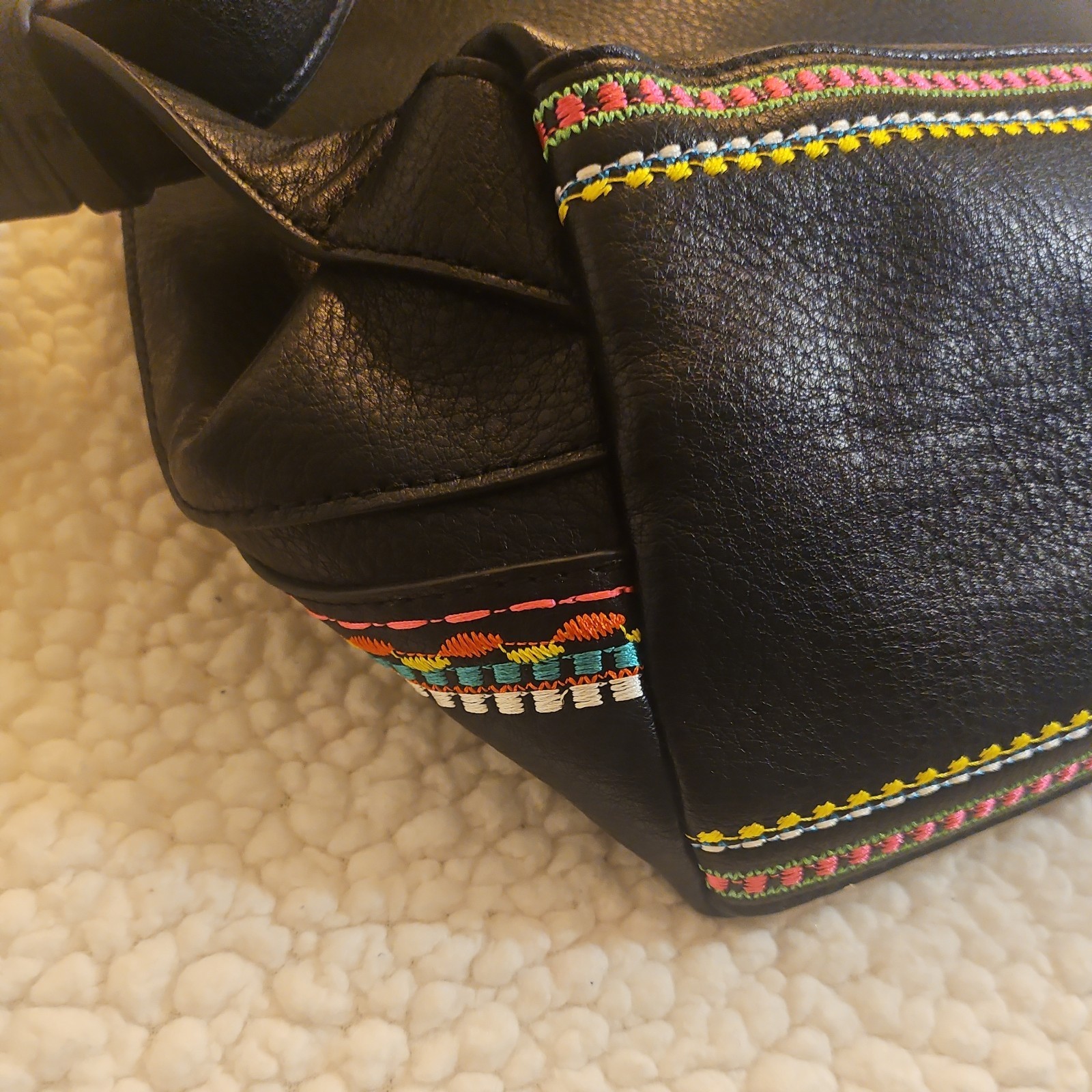 Midsize backpack,multicoloured embroidery,magnetic flap closure, zip, pockets.