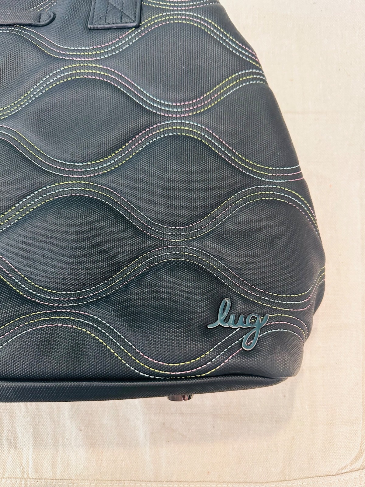 black lug handbag multicolored wavy stitching. Multi functional / very spacious