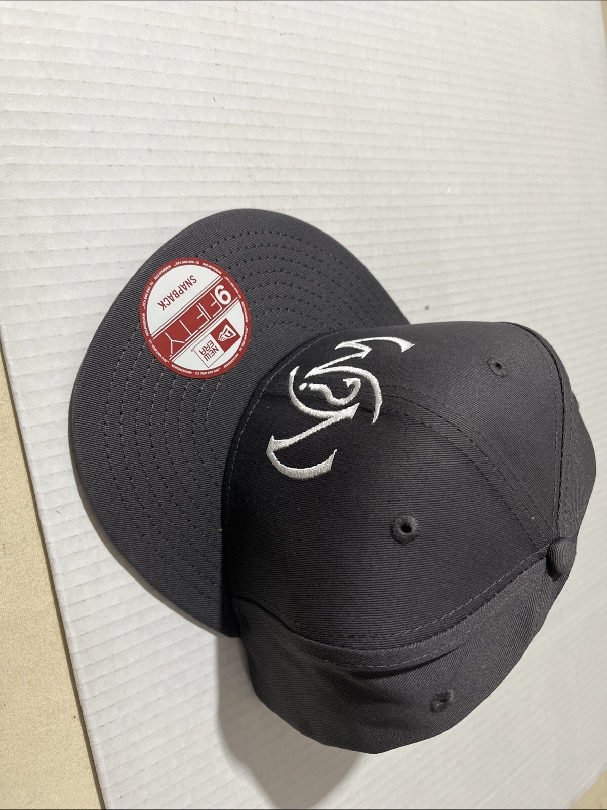 What’s Next New Era 9 Fifty SnapBack Ball Cap New Grey.