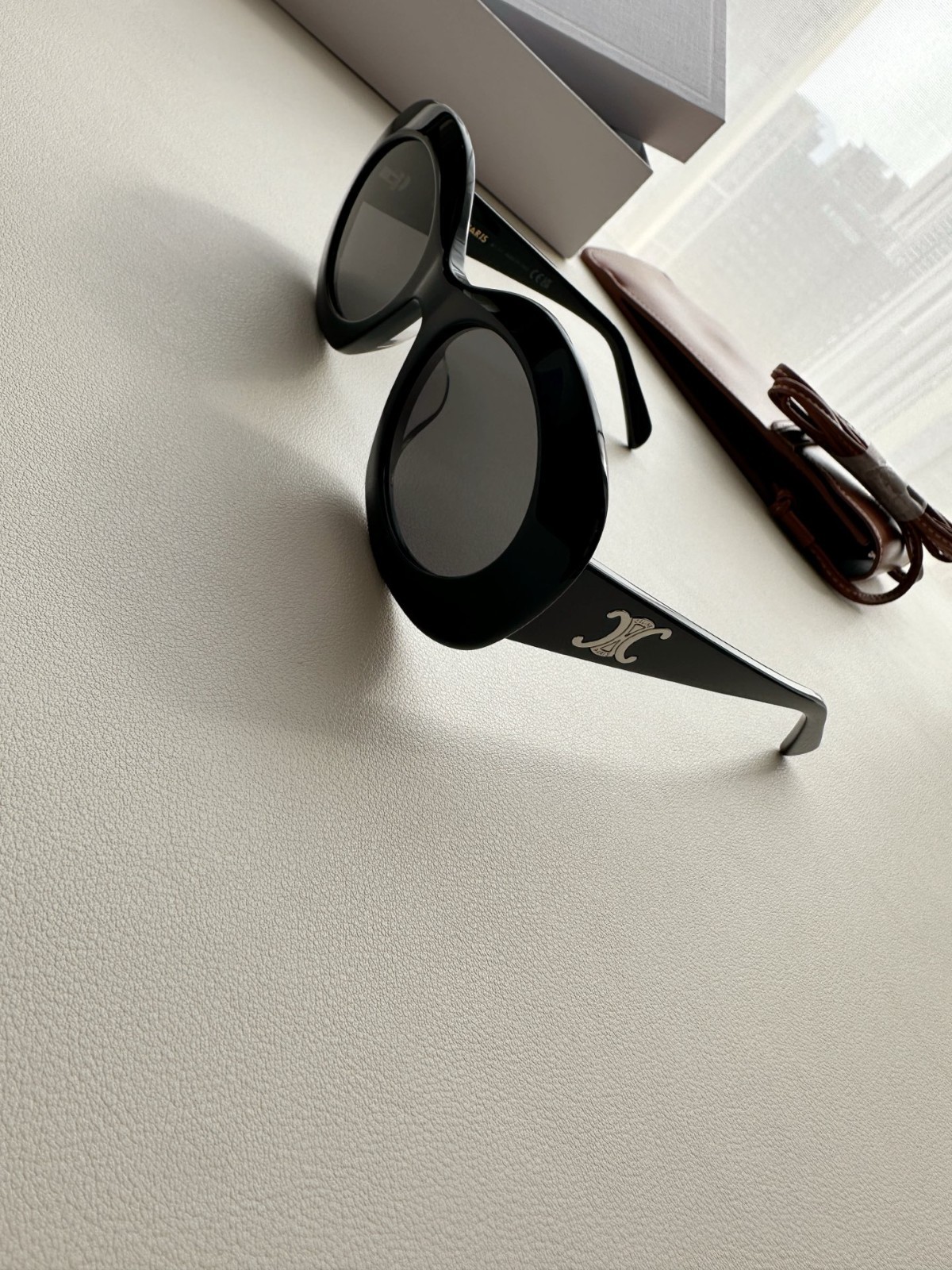 CELINE Iconic Triomphe Oval Sunglasses Black Frame Gold Logo Detail