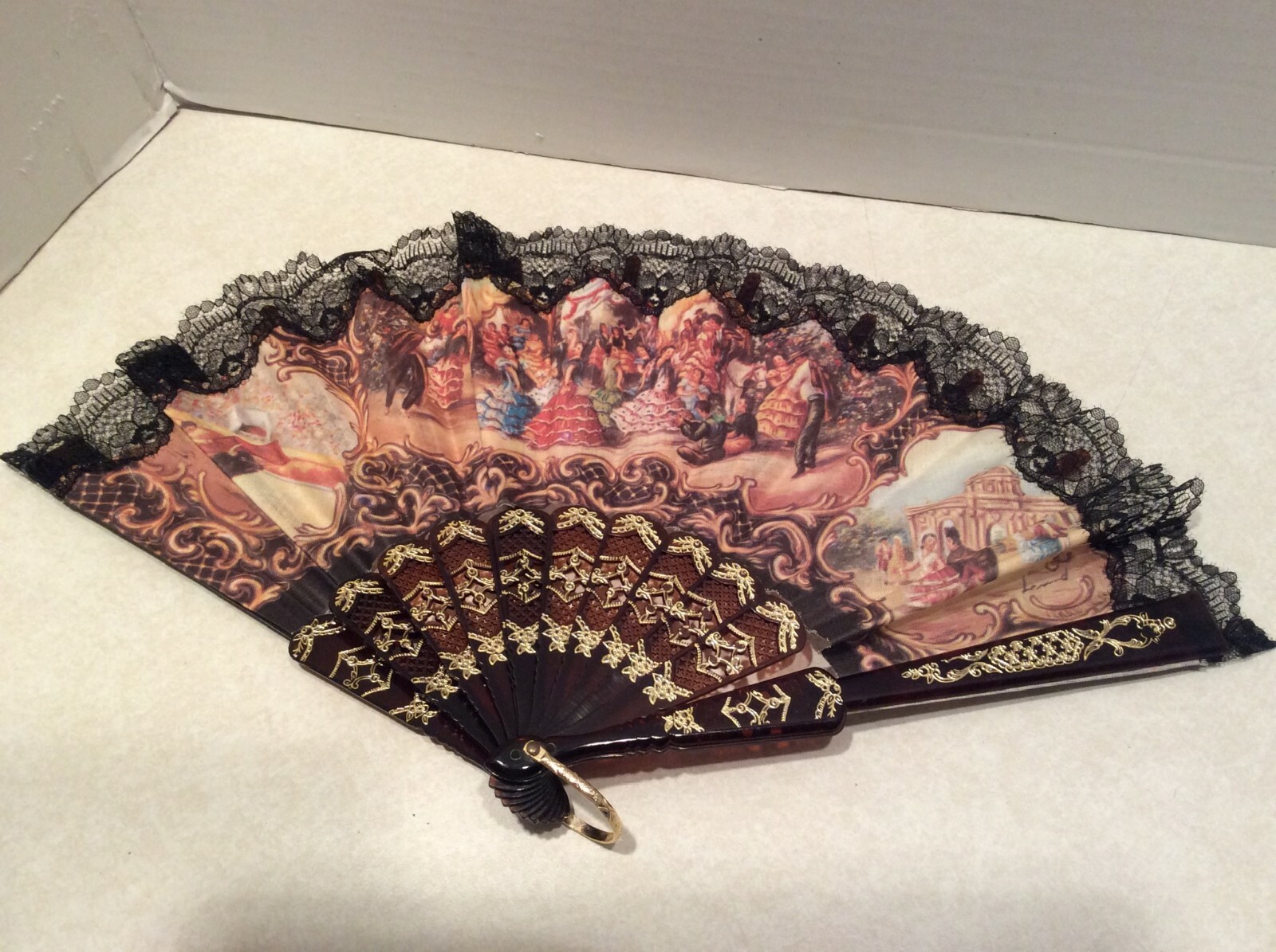 Decorative fabric/plastic hand fan, bull/matador design