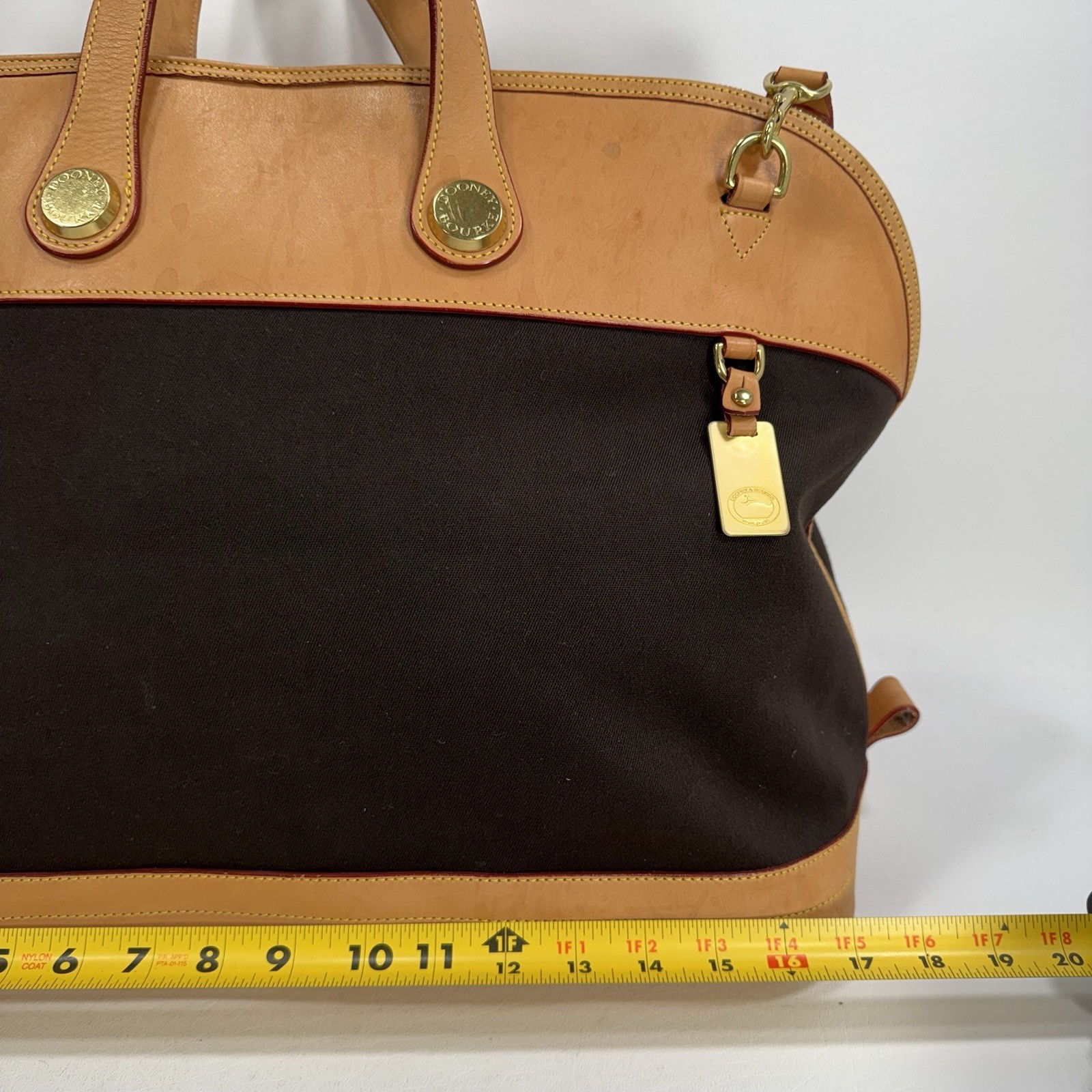 Dooney & Bourke Tan and Black Cabriolet Overnight Travel Bag – See Details