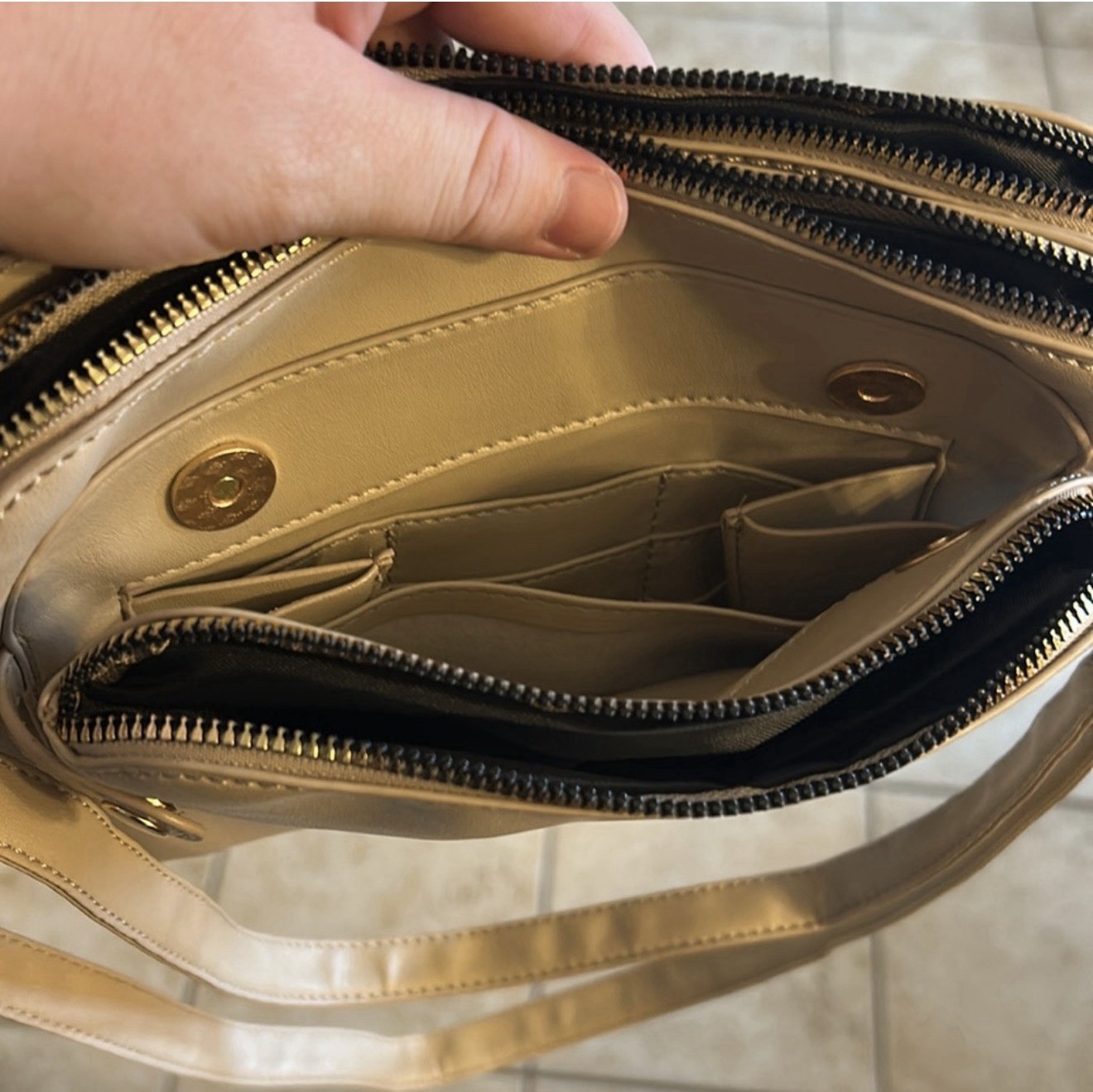 beige shoulder bag gold hardware zip magnetic adjustable strap pockets