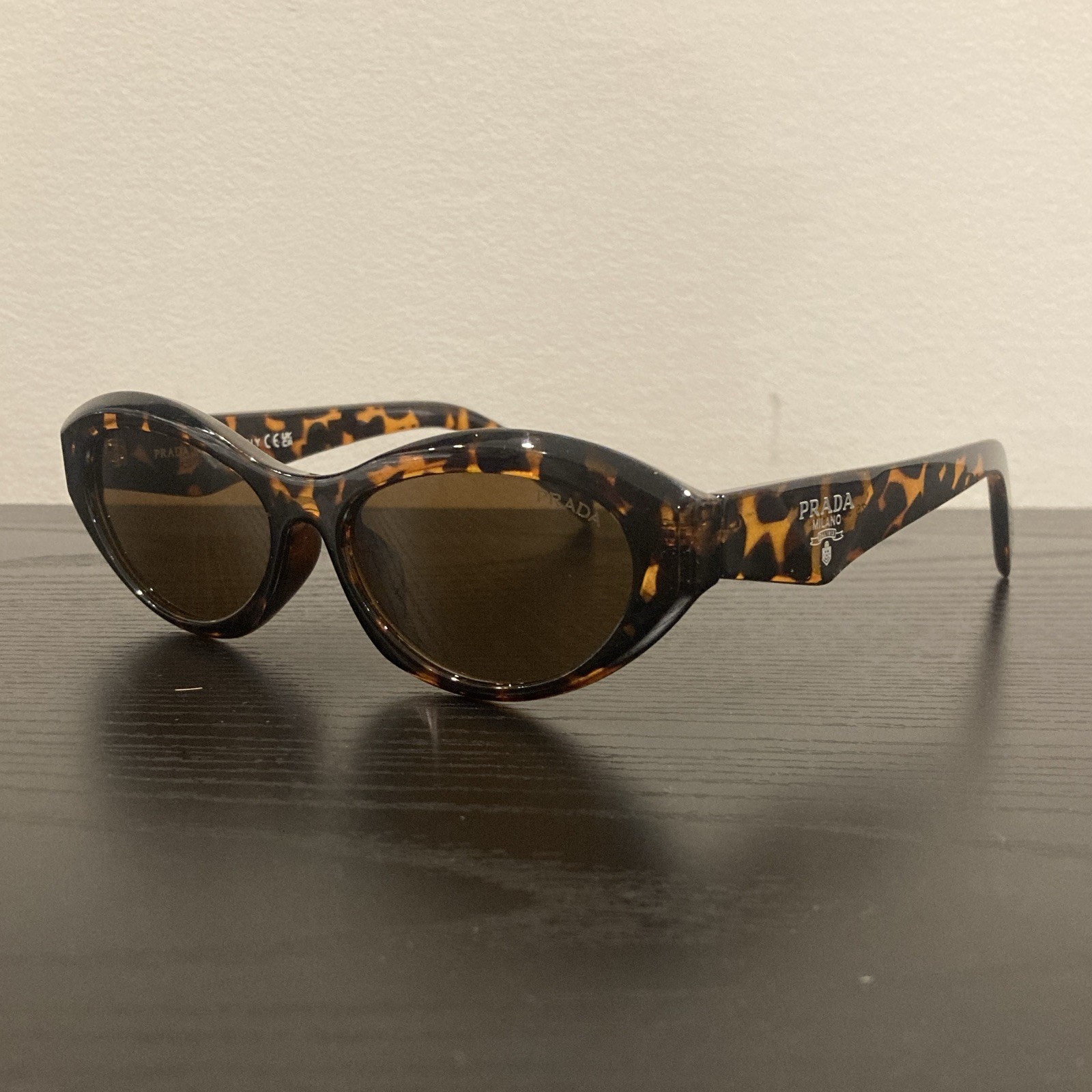 PRADA Women’s Tortoise Shell Oval Sunglasses Brown Plastic Tinted Lens