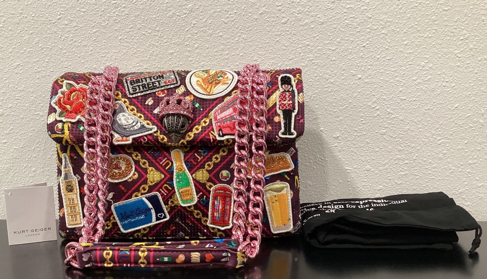 Kurt Geiger London Kensington 10.25″ x 6.5″ x 3.25″ Patches Pink Satin Crystals