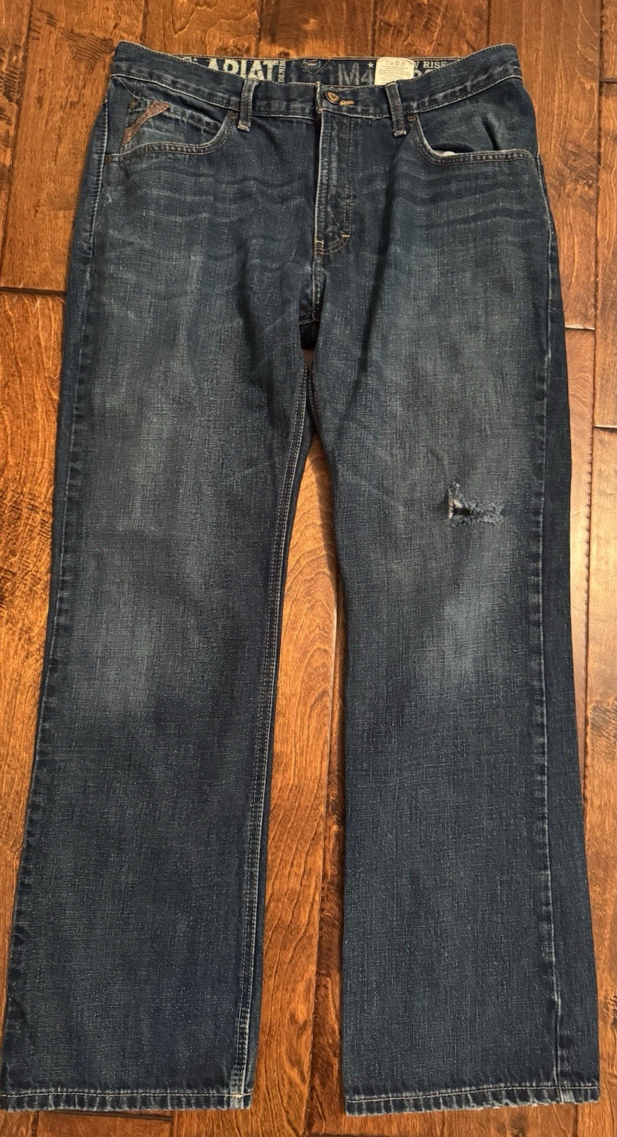 Ariat Men’s Low Rose Boot Cut Jeans 34×32(31.5) Small Rip Reflected In Pictures