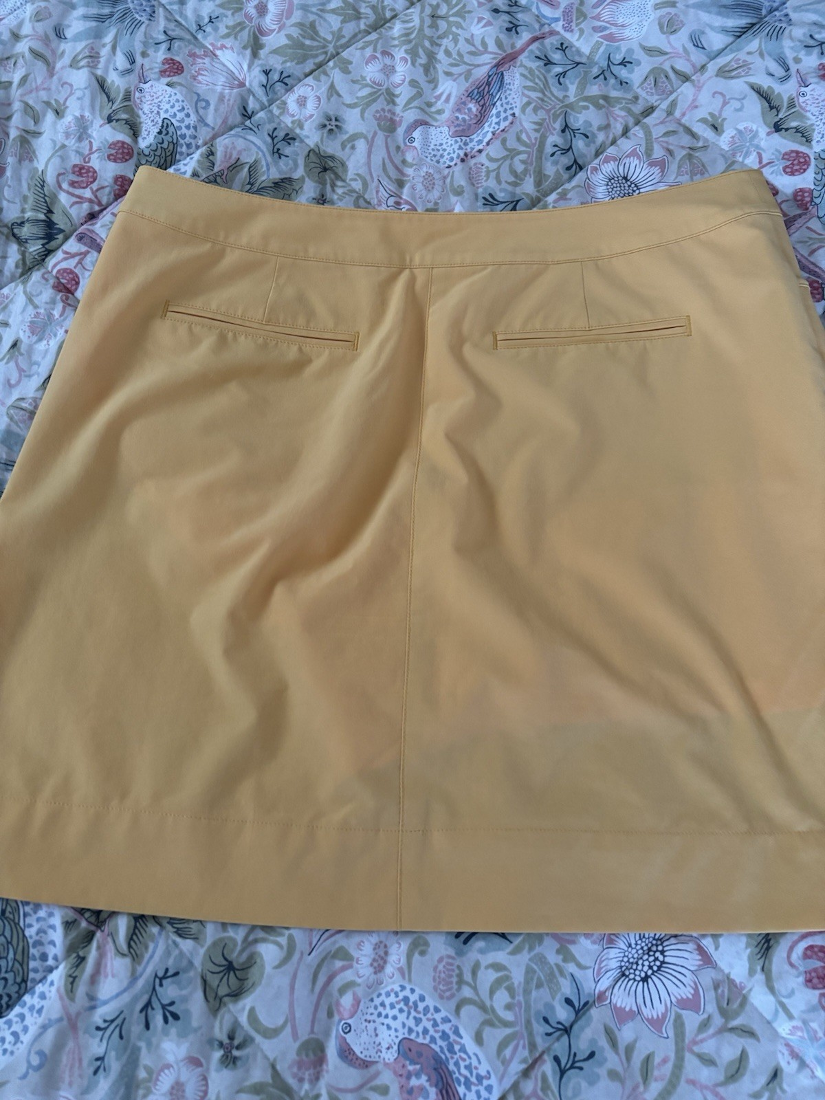 Womens Skorts (4). White, turquoise, tan and yellow. Size 12.