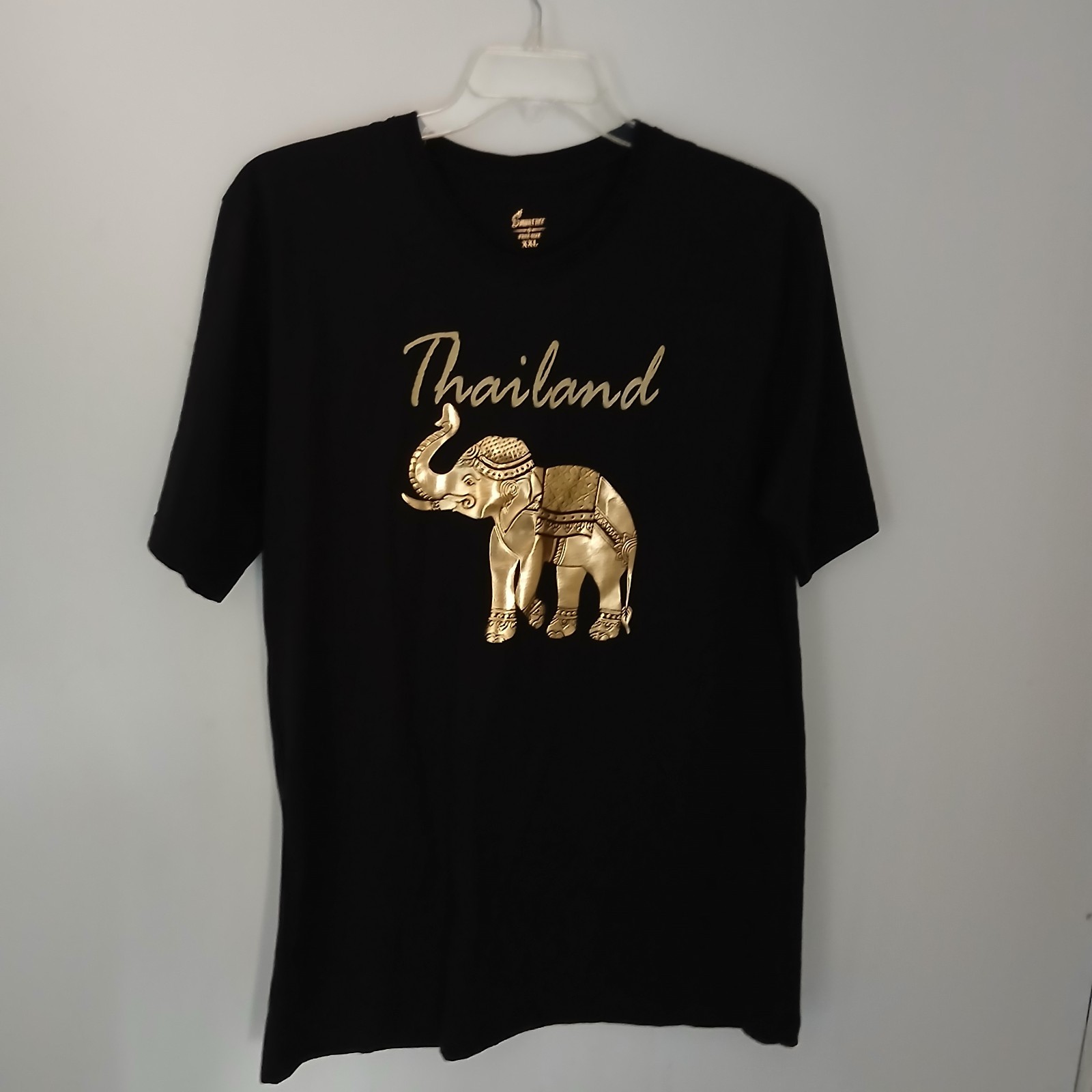 Thailand souvenir shirt featuring a detailed gold-colored elephant